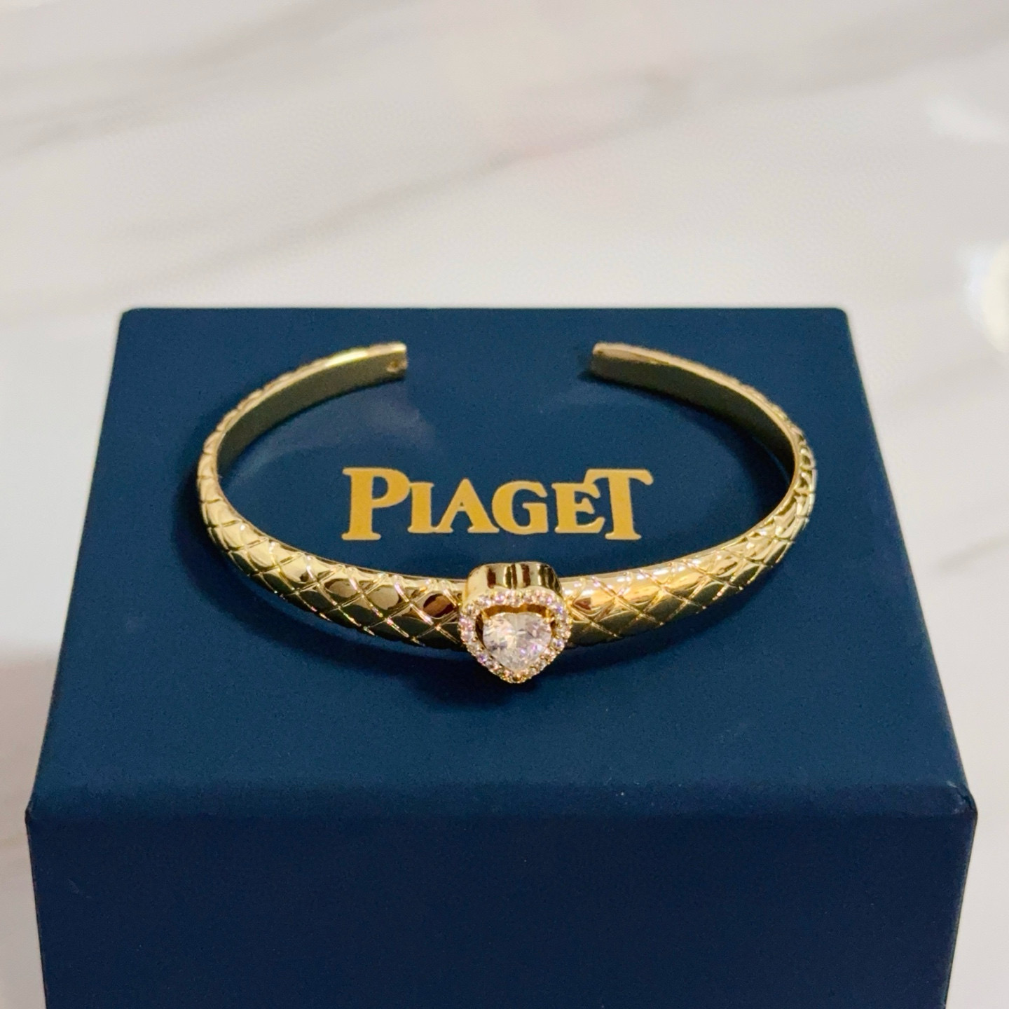 Piaget Heart Diamond Quilted Cuff bracelet 18k yellow gold with clear heart-cut diamond and clear diamond accents 17cm inner circumference