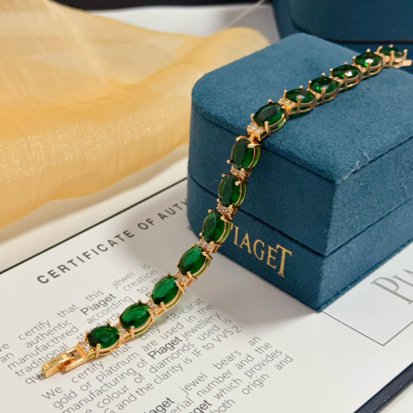 Piaget Oval Green Gemstone Line Bracelet bracelet Rose gold metal with vibrant green oval gemstones and small clear accent stones 18cm