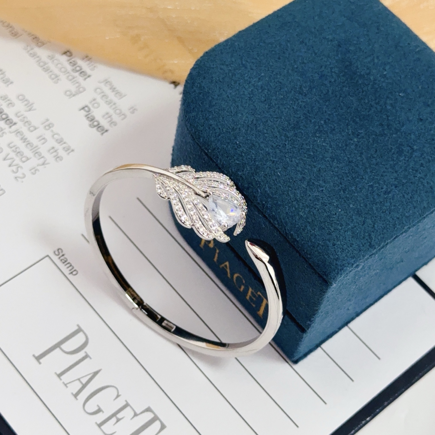 Piaget Feather Diamond Open Bangle bracelet silver-toned white gold metal with clear diamond and pear-shaped clear gemstone accents 17cm inner circumference