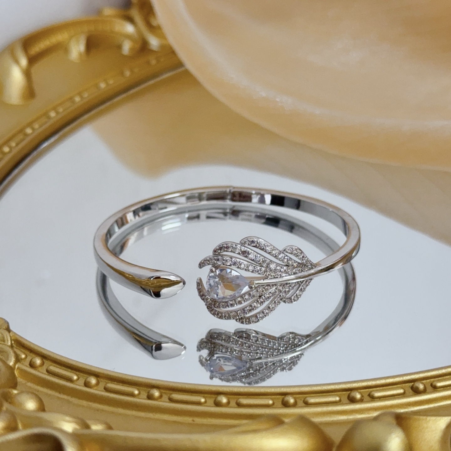 Piaget Feather Diamond Open Bangle bracelet silver-toned white gold metal with clear diamond and pear-shaped clear gemstone accents 17cm inner circumference