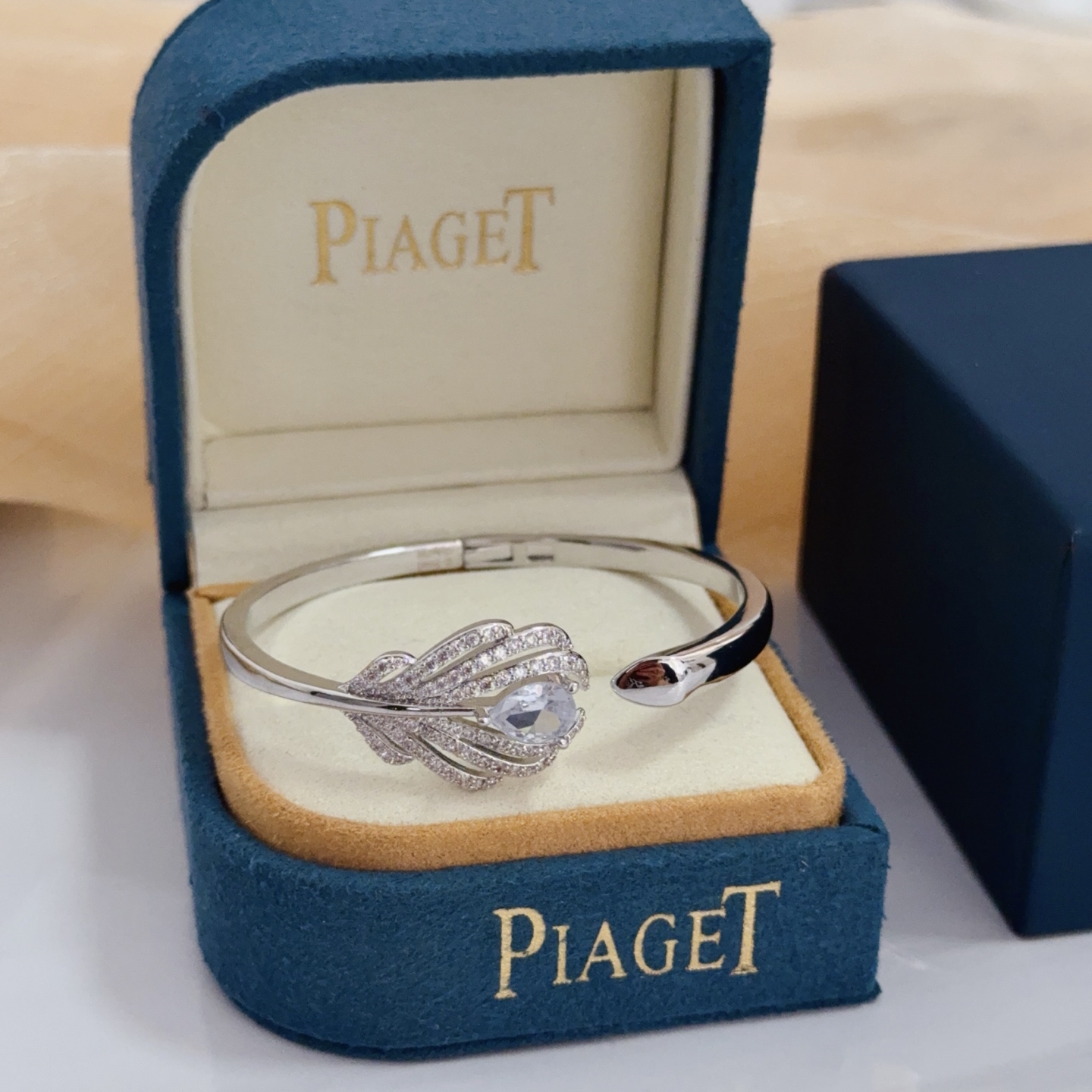 Piaget Feather Diamond Open Bangle bracelet silver-toned white gold metal with clear diamond and pear-shaped clear gemstone accents 17cm inner circumference