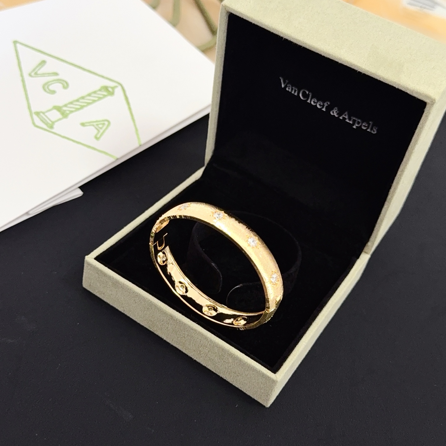 Van Cleef Arpels Four-Leaf Clover Lucky Pattern Multi-layered Carved Bangle bracelet yellow gold metal with clear diamond-like accent stones 17cm inner circumference