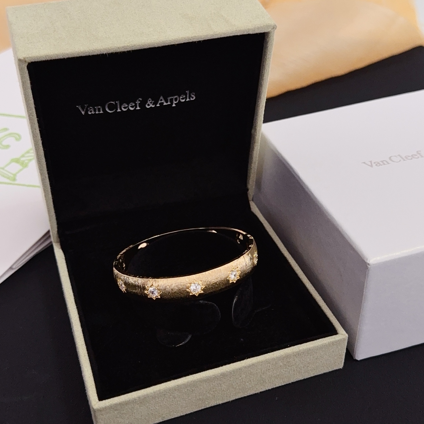 Van Cleef Arpels Four-Leaf Clover Lucky Pattern Multi-layered Carved Bangle bracelet yellow gold metal with clear diamond-like accent stones 17cm inner circumference