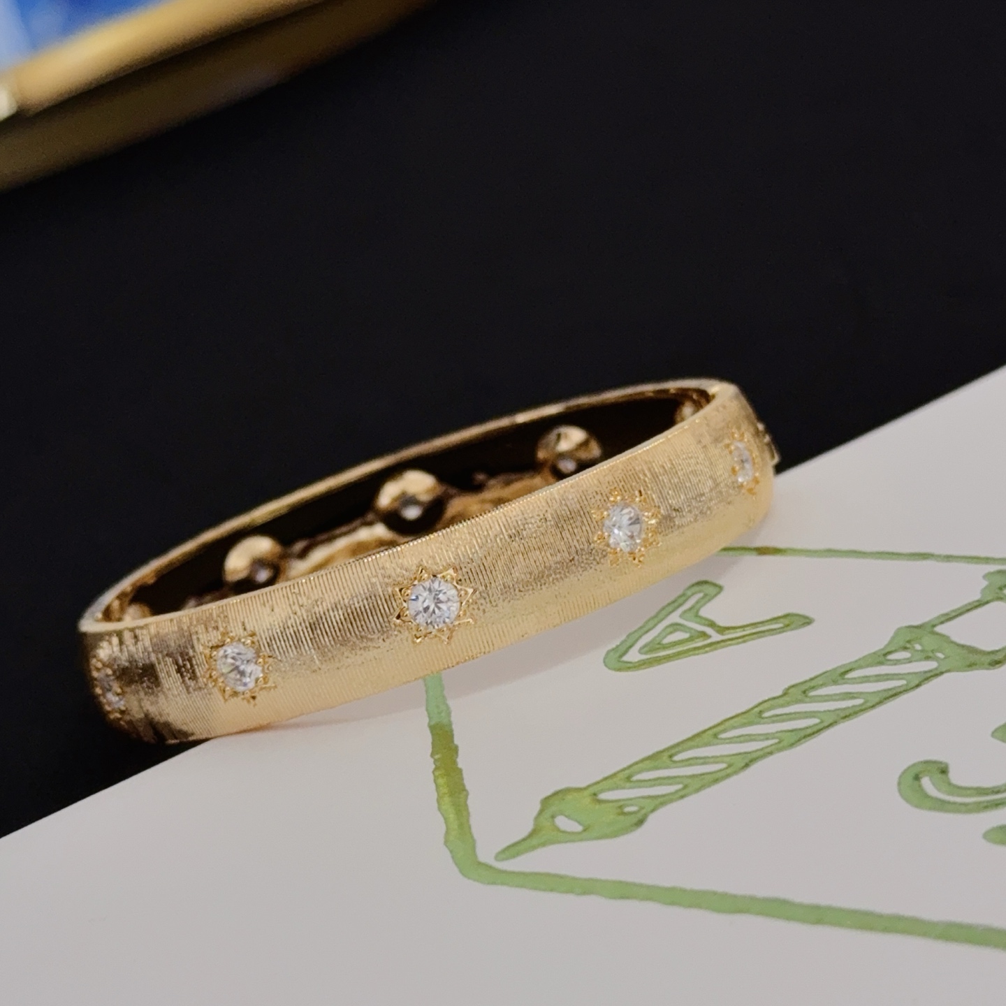 Van Cleef Arpels Four-Leaf Clover Lucky Pattern Multi-layered Carved Bangle bracelet yellow gold metal with clear diamond-like accent stones 17cm inner circumference