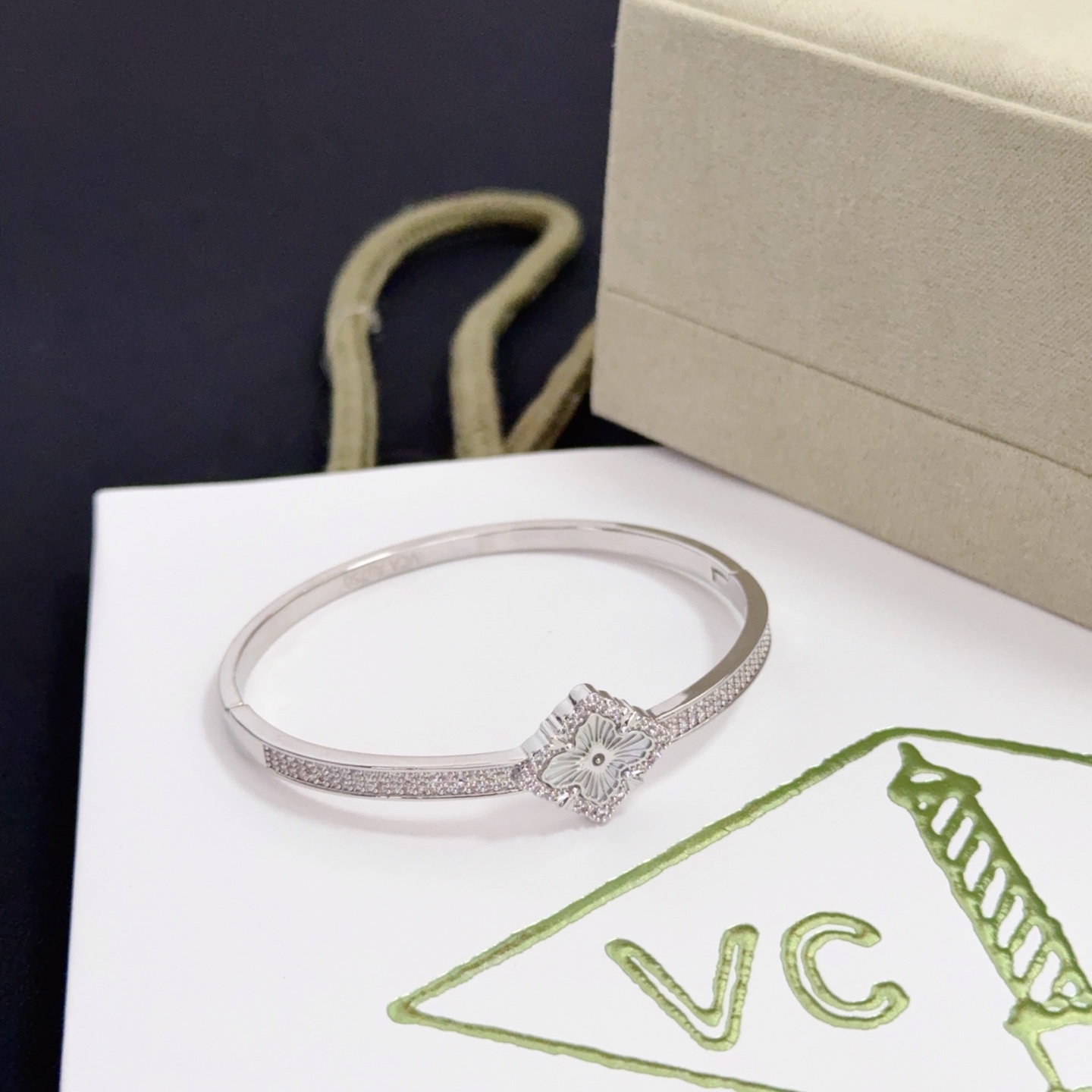 Van Cleef Arpels Alhambra bracelet silver-toned metal with clear diamond accents and silver guilloche clover motif 17cm