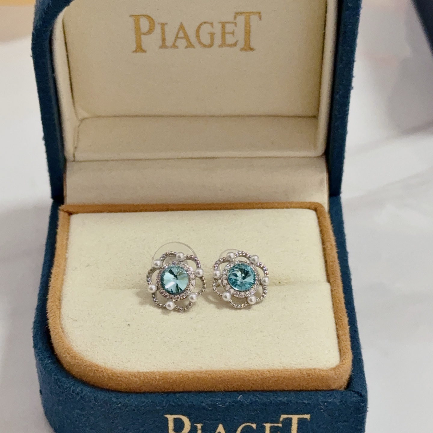 Piaget Rose earrings silver-toned white gold aqua blue central gemstone white diamond accents white pearl accents 10mm stud diameter