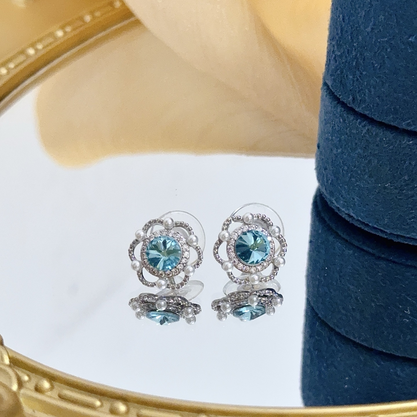 Piaget Rose earrings silver-toned white gold aqua blue central gemstone white diamond accents white pearl accents 10mm stud diameter