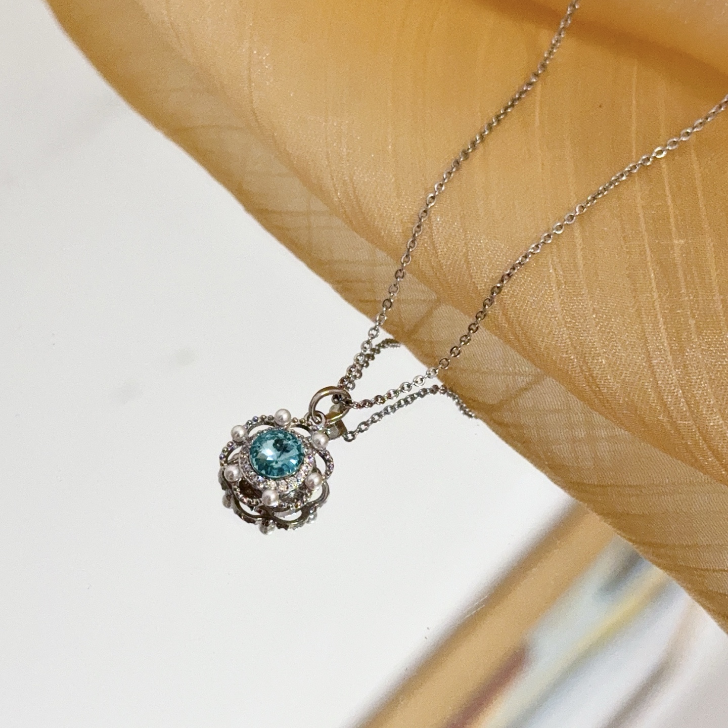 Piaget Rose necklace silver-toned metal sky blue gemstone clear diamond accents white pearl accents 42cm