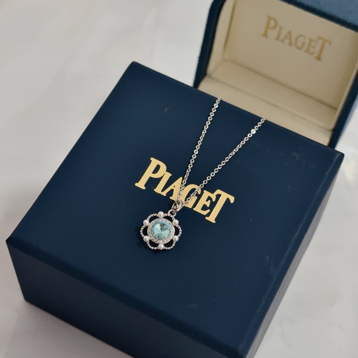 Piaget Rose necklace silver-toned metal sky blue gemstone clear diamond accents white pearl accents 42cm