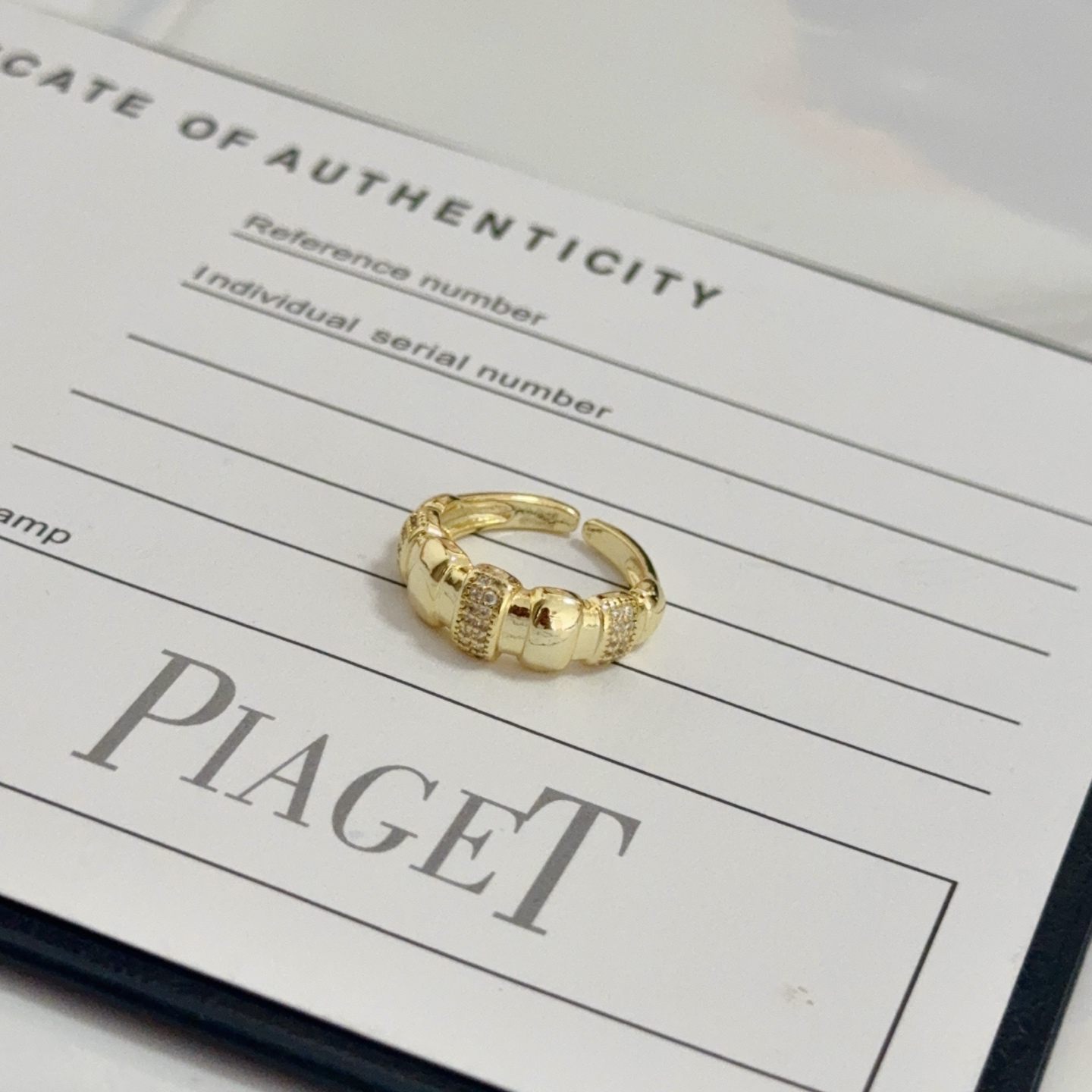 Piaget Possession ring yellow gold with clear diamond accents adjustable open band