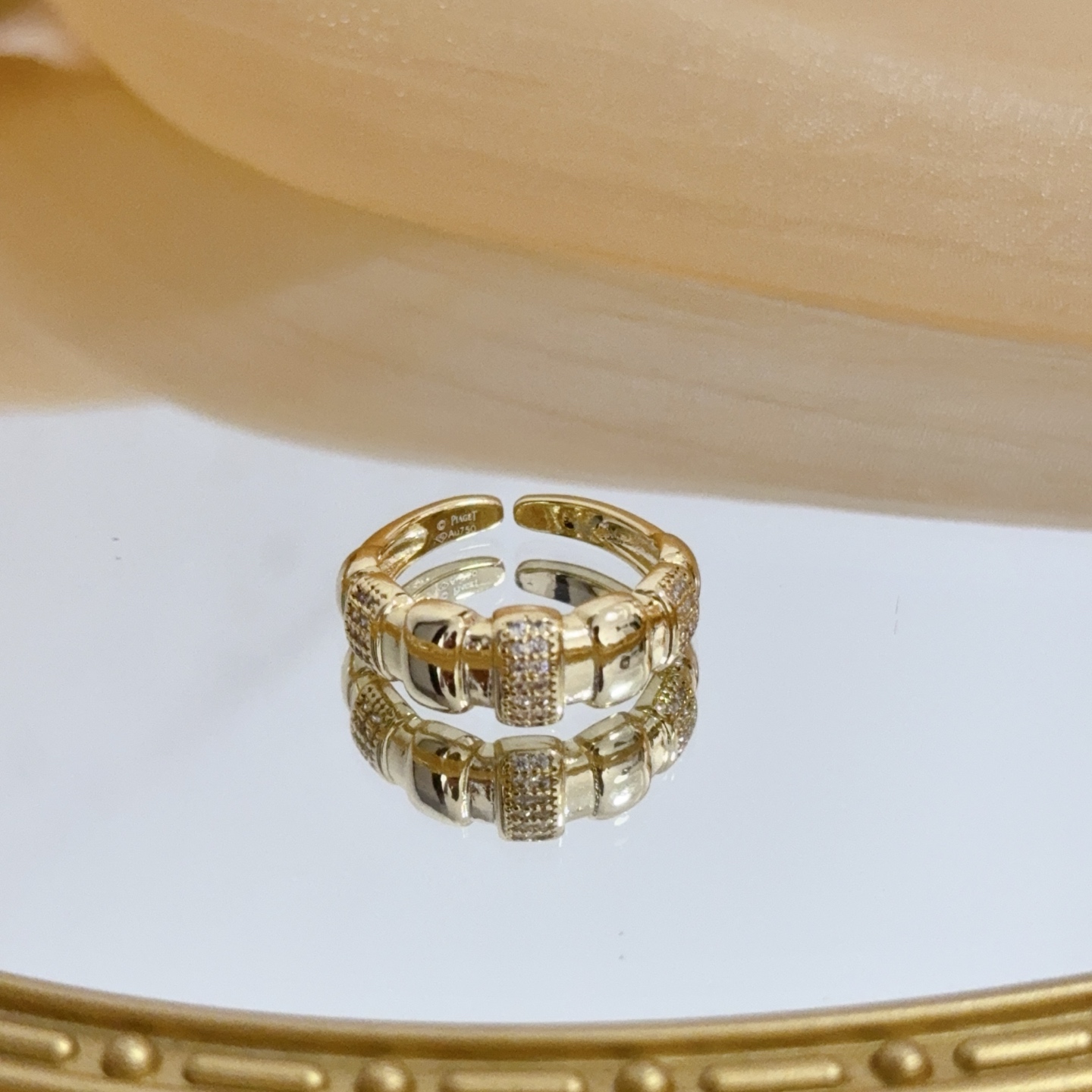 Piaget Possession ring yellow gold with clear diamond accents adjustable open band