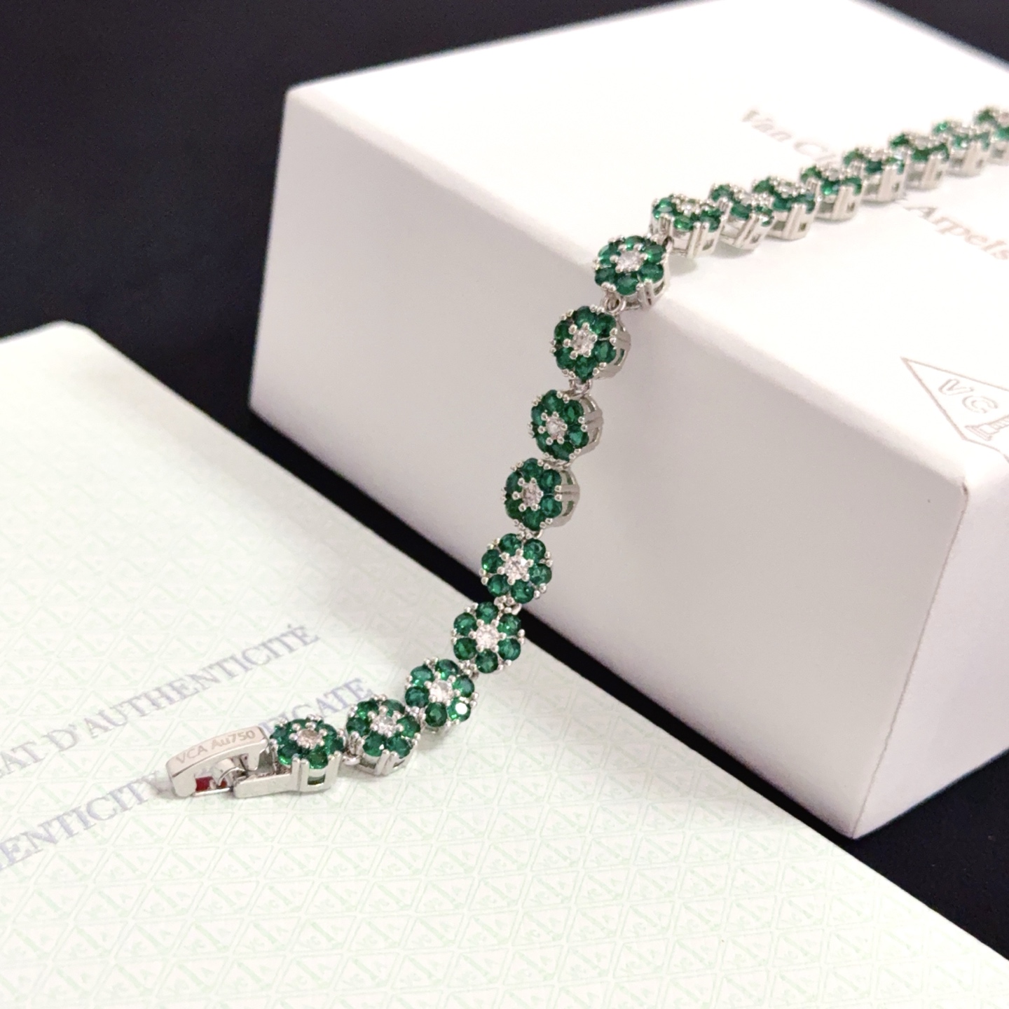 Van Cleef Arpels Fleurette bracelet silver-toned white gold metal emerald green gemstones clear white diamonds 18cm