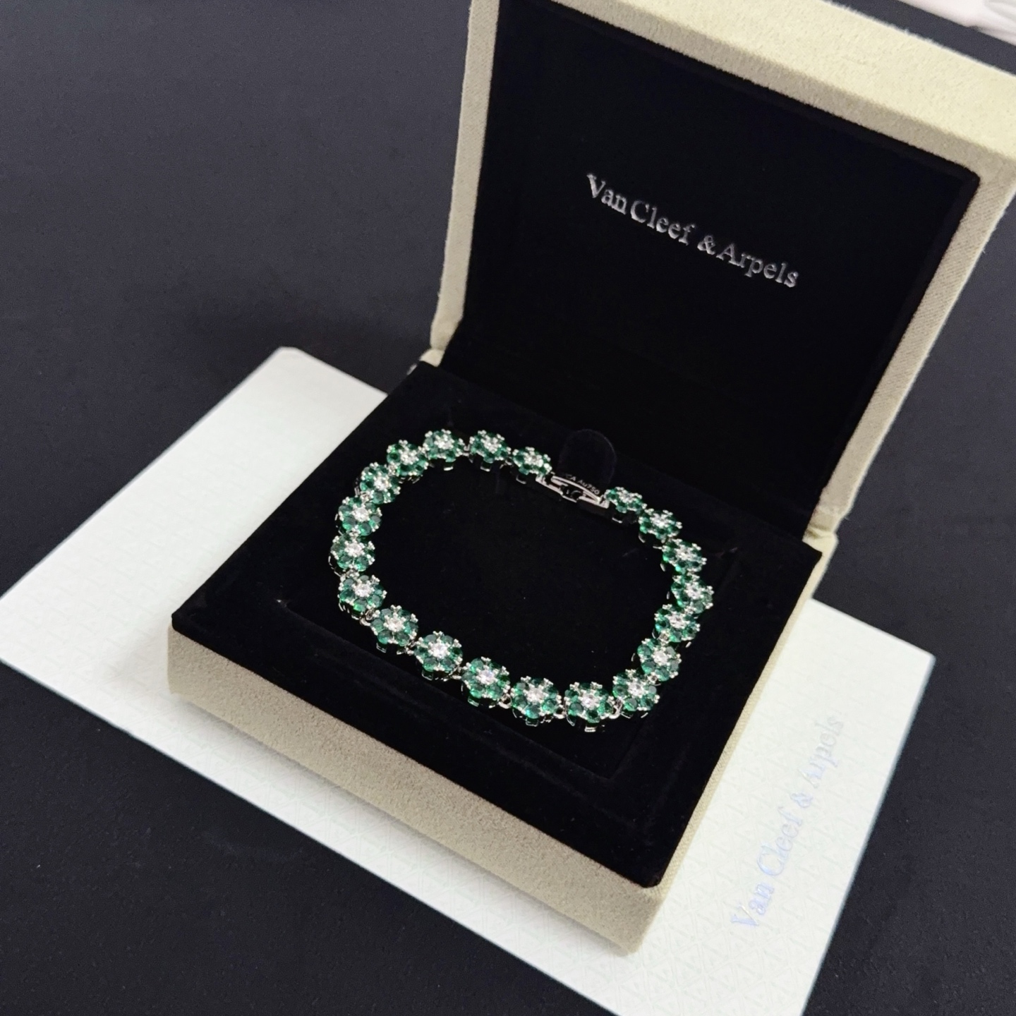 Van Cleef Arpels Fleurette bracelet silver-toned white gold metal emerald green gemstones clear white diamonds 18cm
