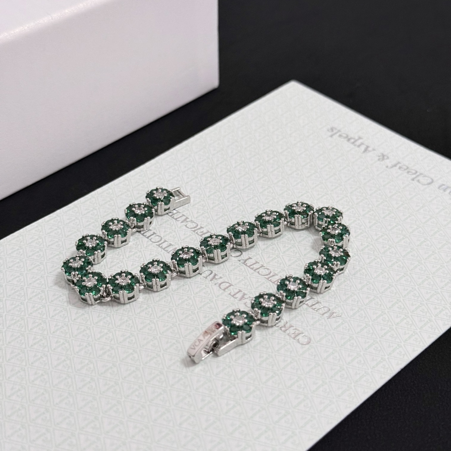 Van Cleef Arpels Fleurette bracelet silver-toned white gold metal emerald green gemstones clear white diamonds 18cm