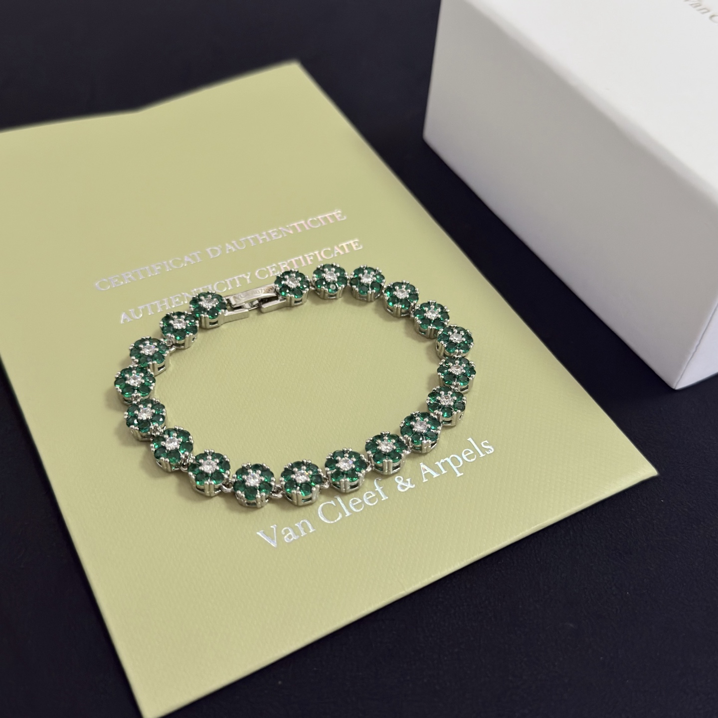 Van Cleef Arpels Fleurette bracelet silver-toned white gold metal emerald green gemstones clear white diamonds 18cm