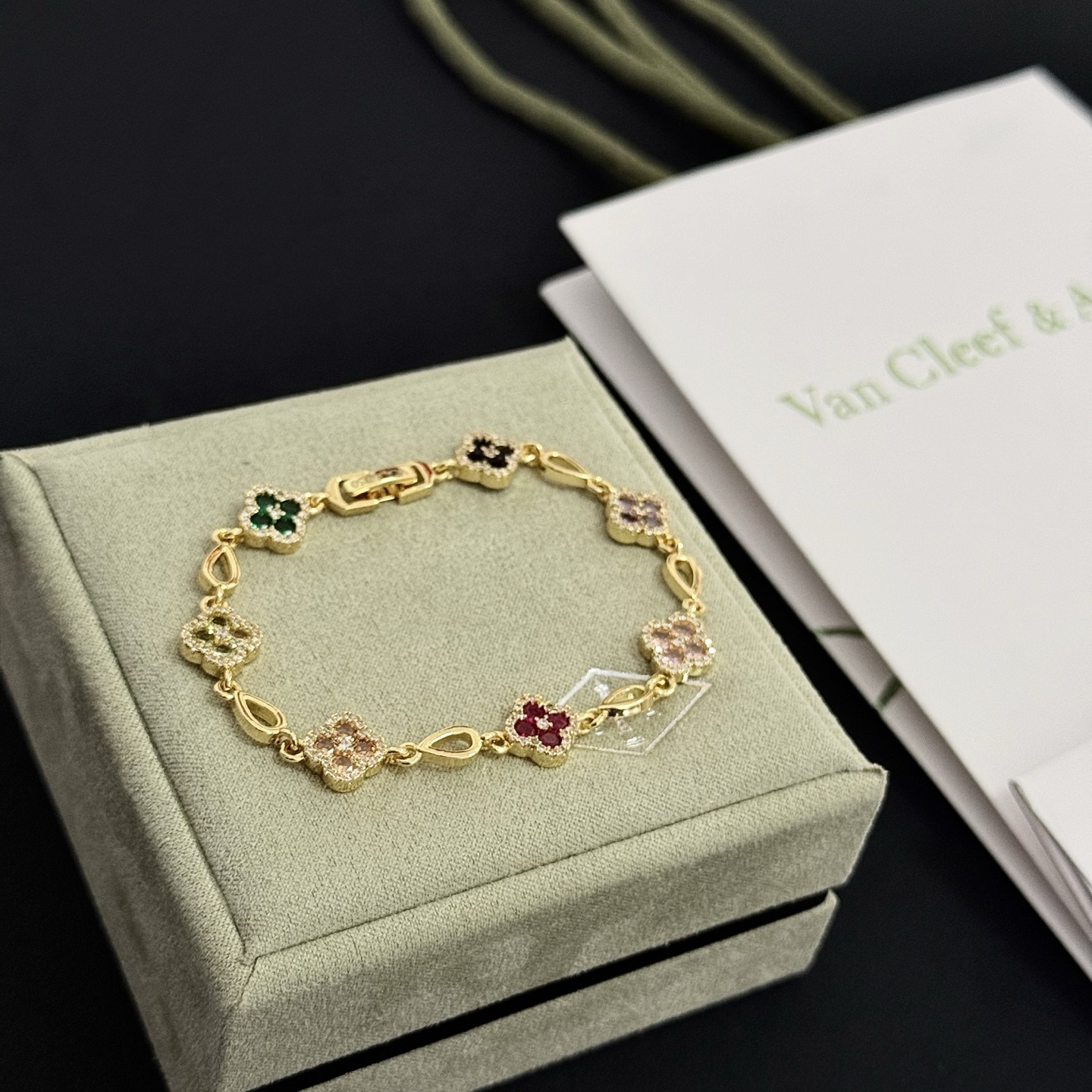 Van Cleef Arpels Alhambra bracelet Yellow gold with multicolor gemstones peridot emerald onyx amethyst pink sapphire ruby diamond accents 18cm
