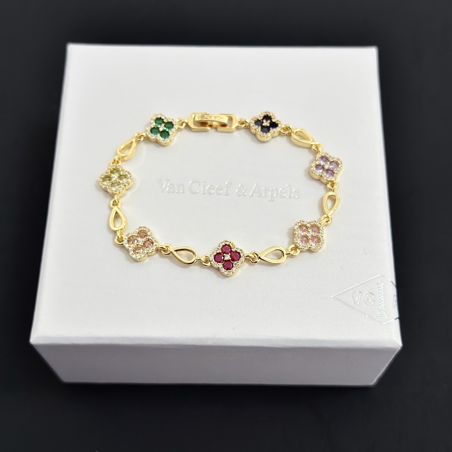 Van Cleef Arpels Alhambra bracelet Yellow gold with multicolor gemstones peridot emerald onyx amethyst pink sapphire ruby diamond accents 18cm