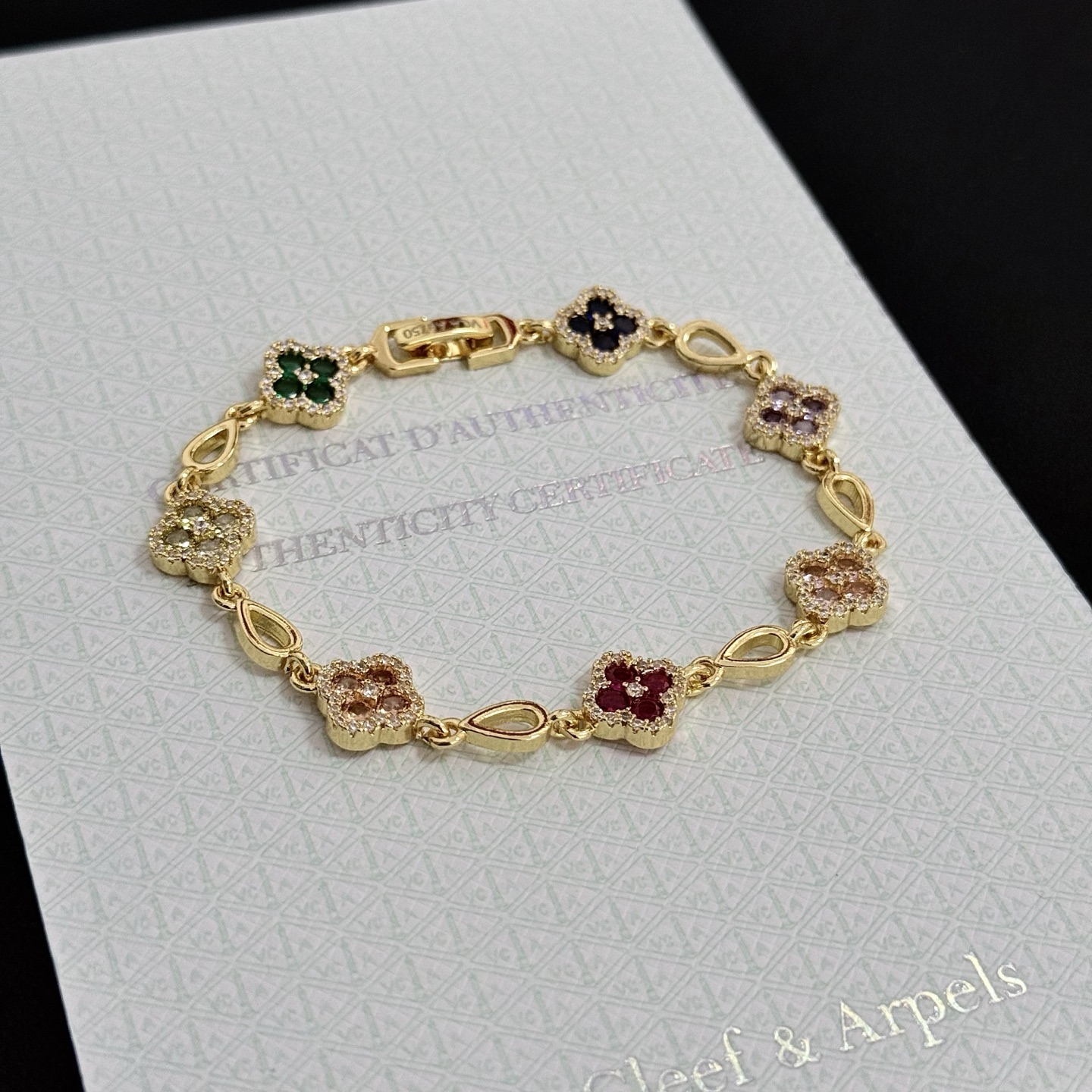 Van Cleef Arpels Alhambra bracelet Yellow gold with multicolor gemstones peridot emerald onyx amethyst pink sapphire ruby diamond accents 18cm