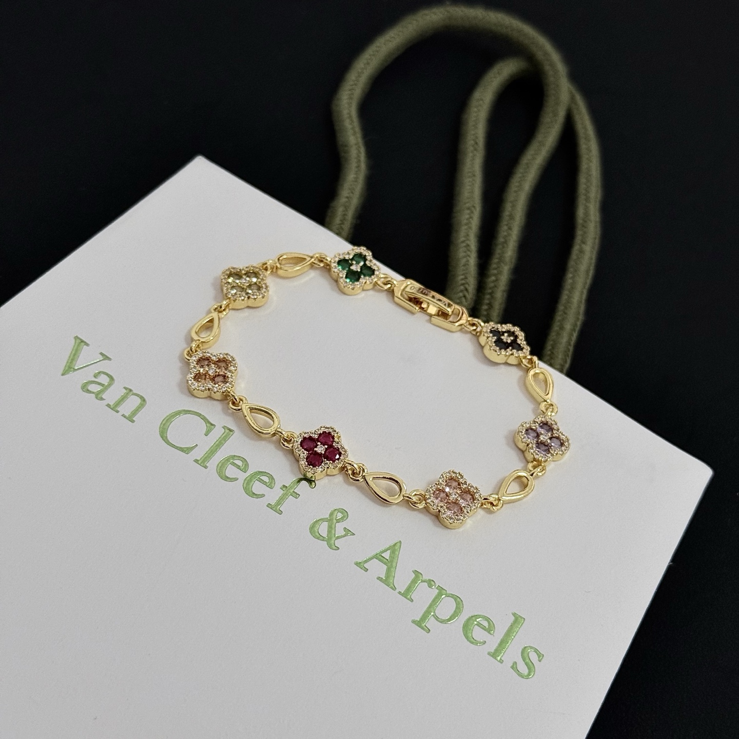 Van Cleef Arpels Alhambra bracelet Yellow gold with multicolor gemstones peridot emerald onyx amethyst pink sapphire ruby diamond accents 18cm
