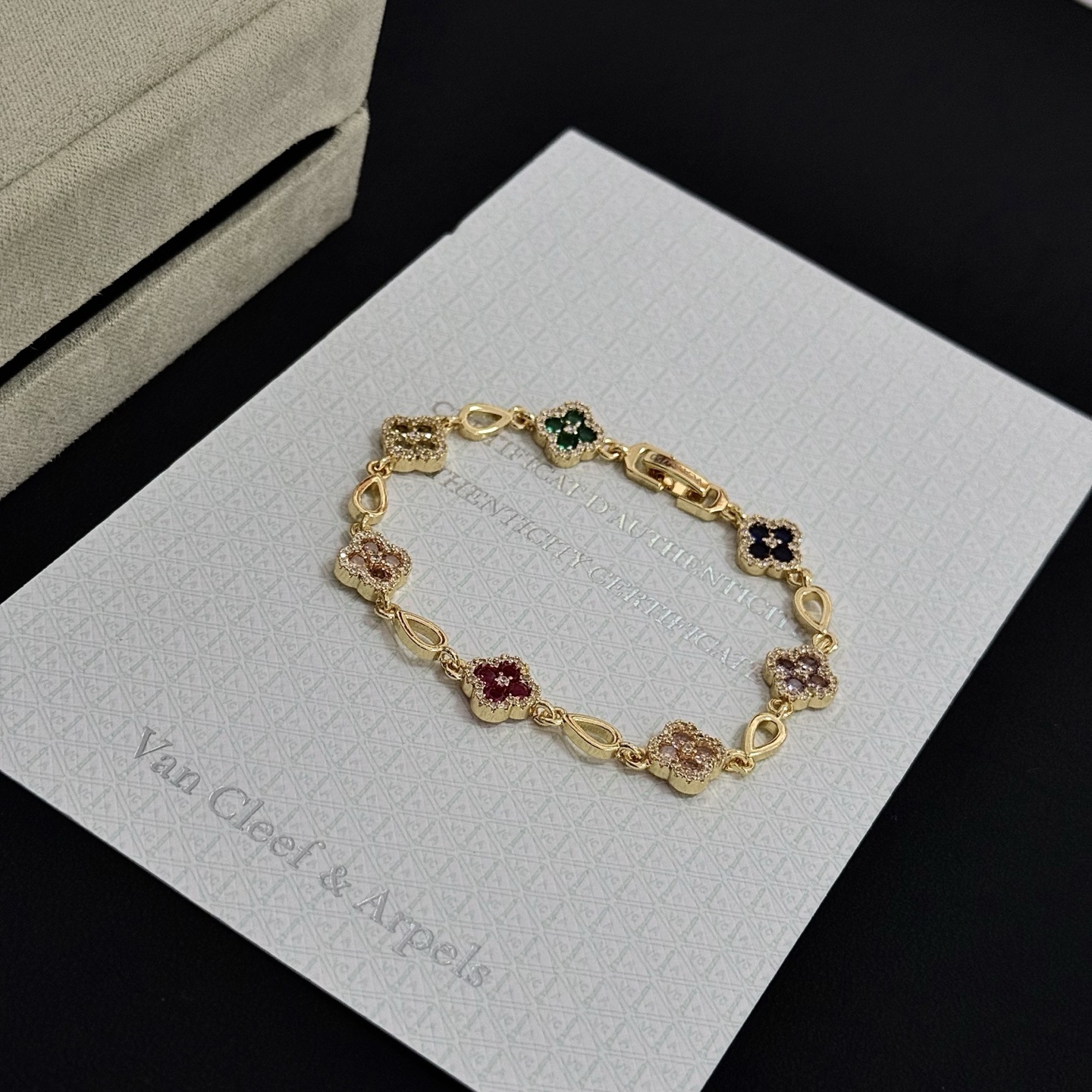 Van Cleef Arpels Alhambra bracelet Yellow gold with multicolor gemstones peridot emerald onyx amethyst pink sapphire ruby diamond accents 18cm