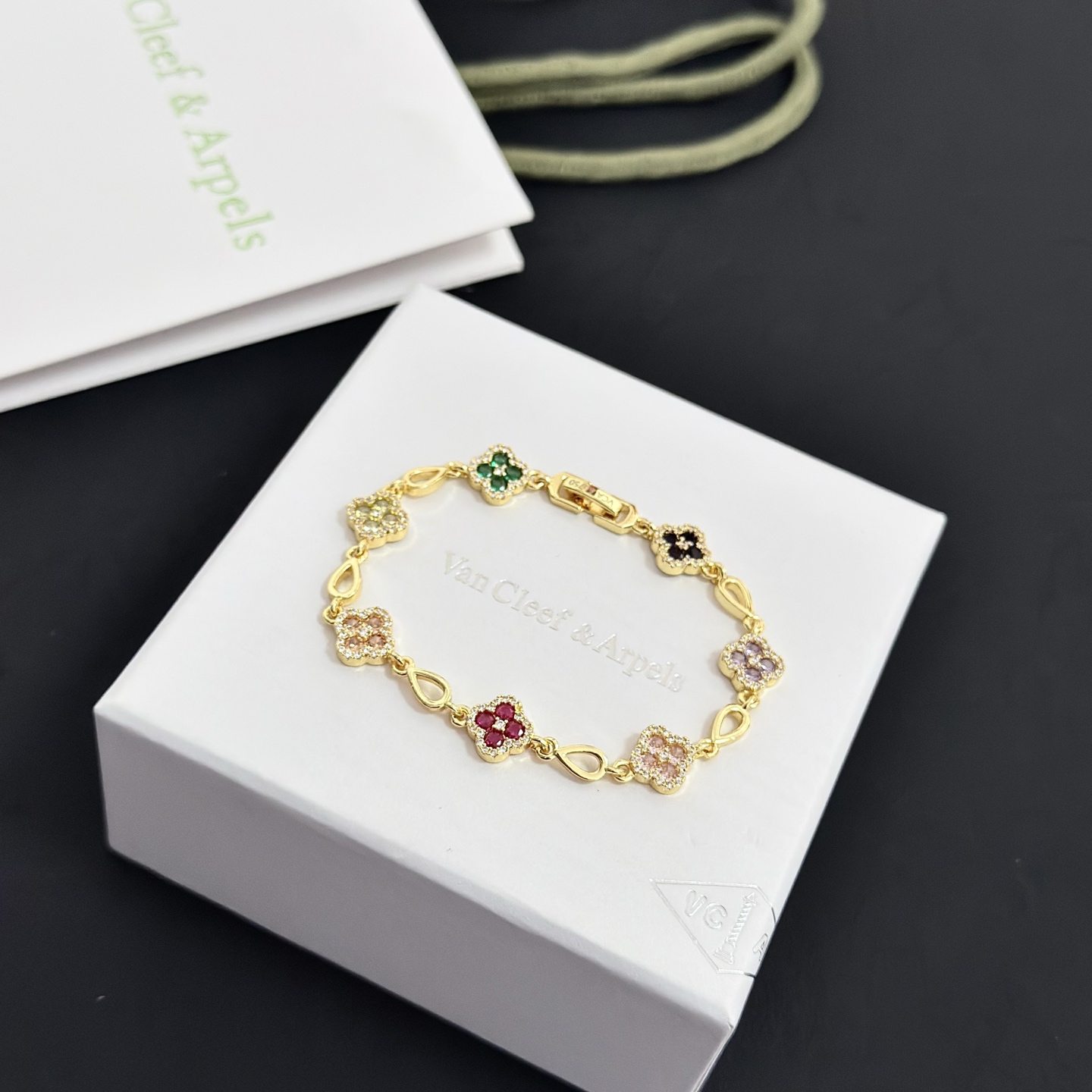 Van Cleef Arpels Alhambra bracelet Yellow gold with multicolor gemstones peridot emerald onyx amethyst pink sapphire ruby diamond accents 18cm