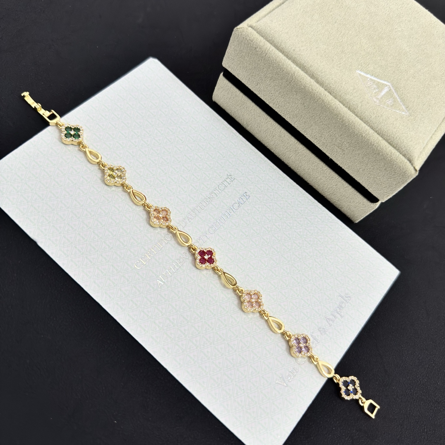 Van Cleef Arpels Alhambra bracelet Yellow gold with multicolor gemstones peridot emerald onyx amethyst pink sapphire ruby diamond accents 18cm