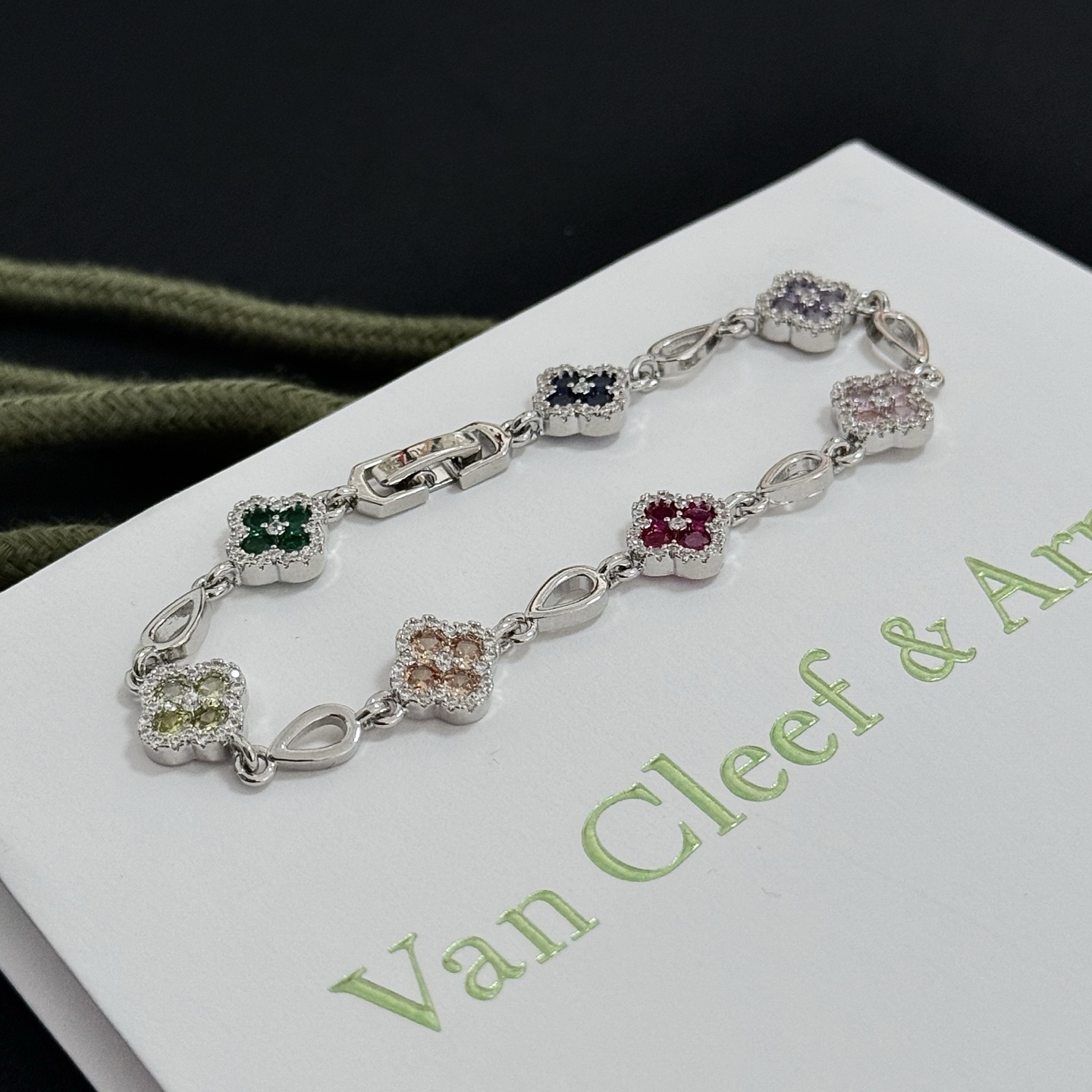 Van Cleef Arpels Alhambra bracelet Silver-toned metal with multicolor gemstones pink red champagne yellow purple dark blue green accented by white diamonds 17cm