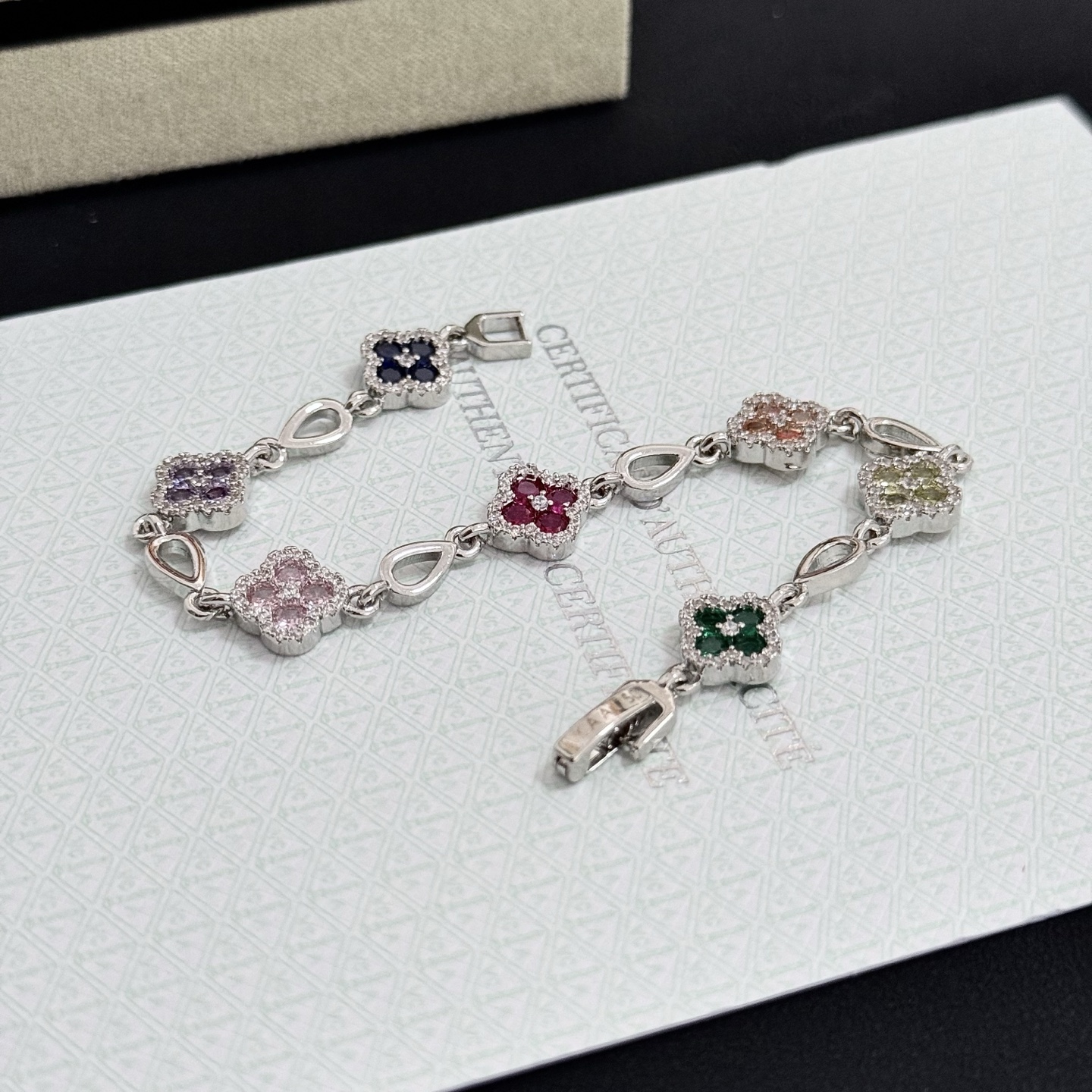 Van Cleef Arpels Alhambra bracelet Silver-toned metal with multicolor gemstones pink red champagne yellow purple dark blue green accented by white diamonds 17cm