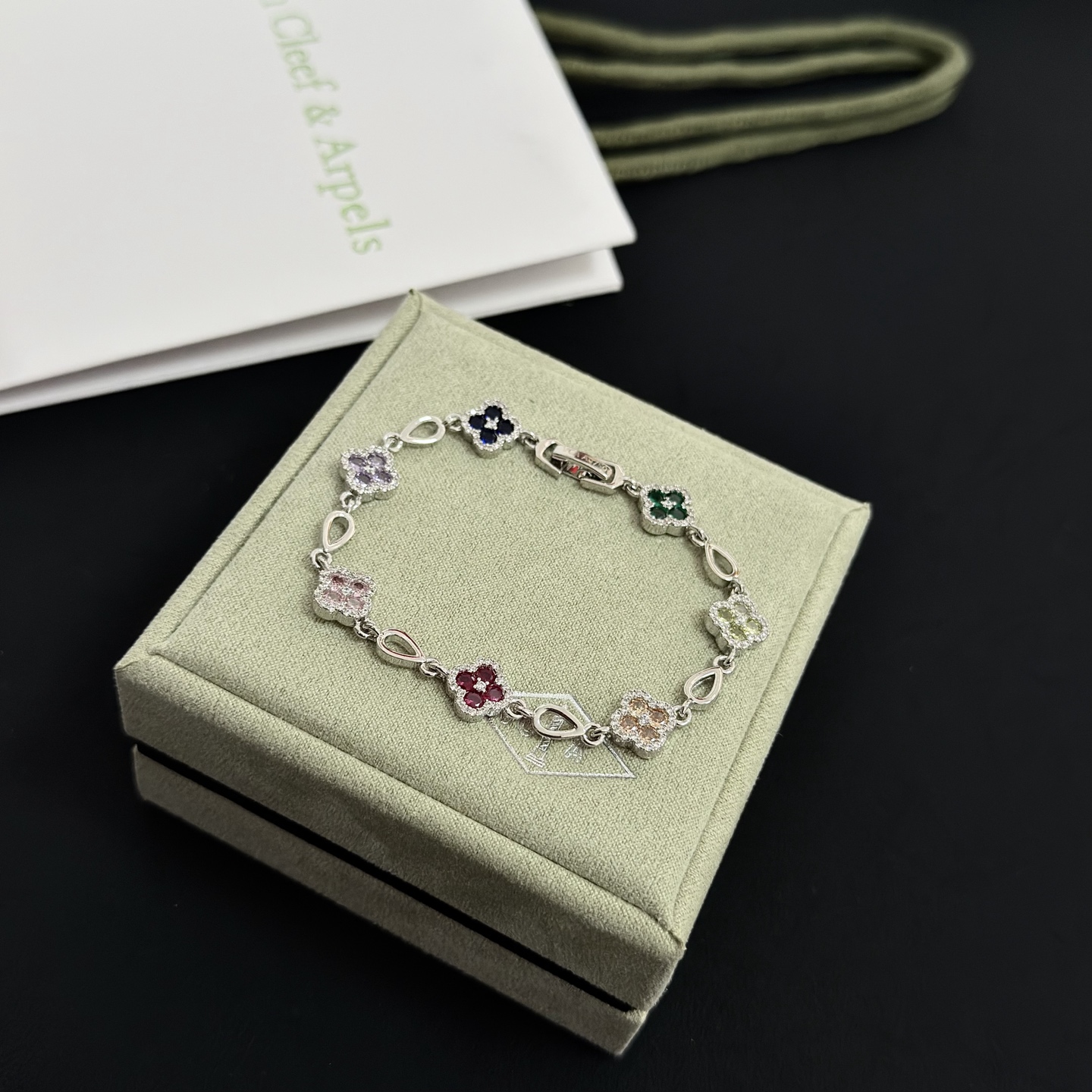 Van Cleef Arpels Alhambra bracelet Silver-toned metal with multicolor gemstones pink red champagne yellow purple dark blue green accented by white diamonds 17cm