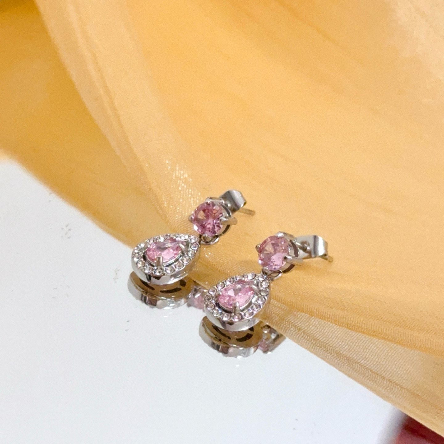 Piaget Rose Passion Teardrop Drop Earrings earrings silver-toned white gold metal with pink sapphire center stones and white diamond halo accents 1 2cm drop length