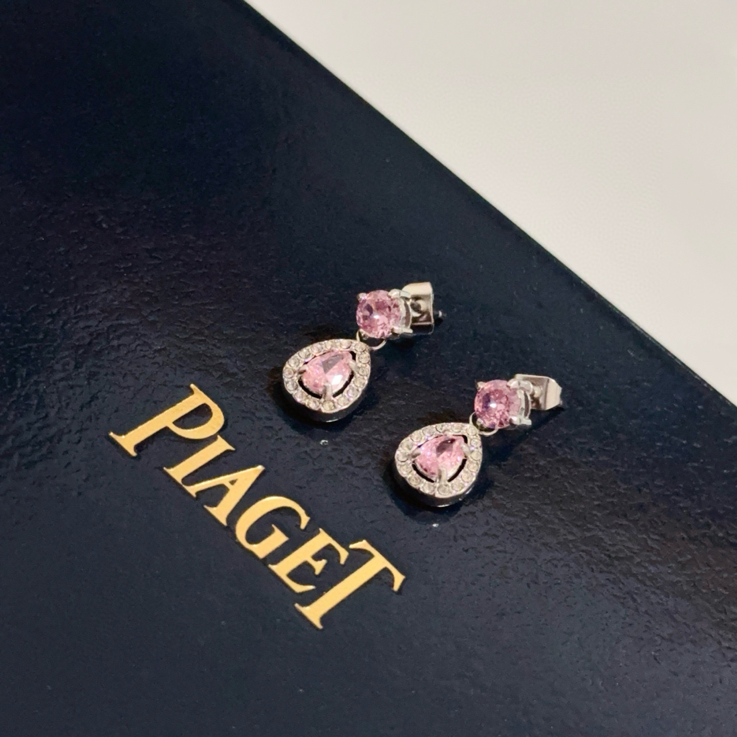 Piaget Rose Passion Teardrop Drop Earrings earrings silver-toned white gold metal with pink sapphire center stones and white diamond halo accents 1 2cm drop length