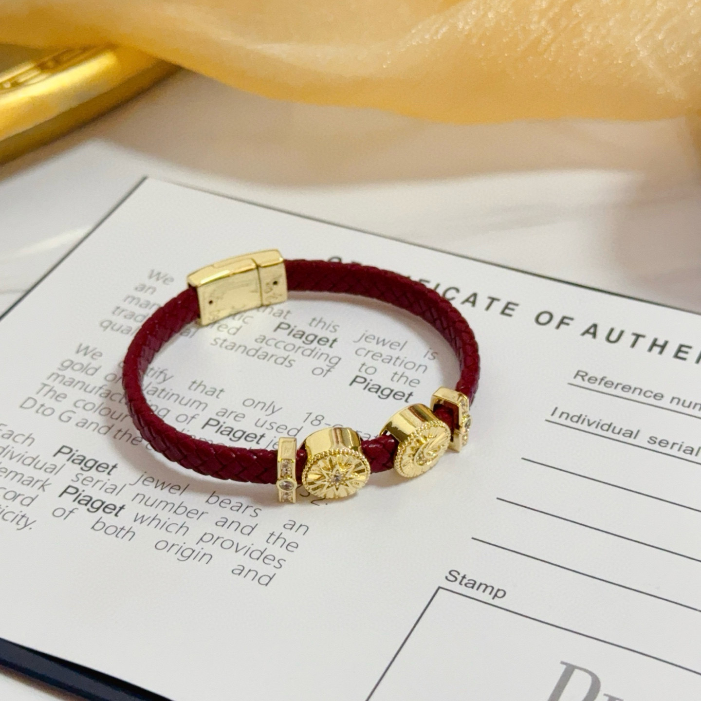 Piaget Possession bracelet Yellow gold burgundy braided leather clear diamond accents 17cm