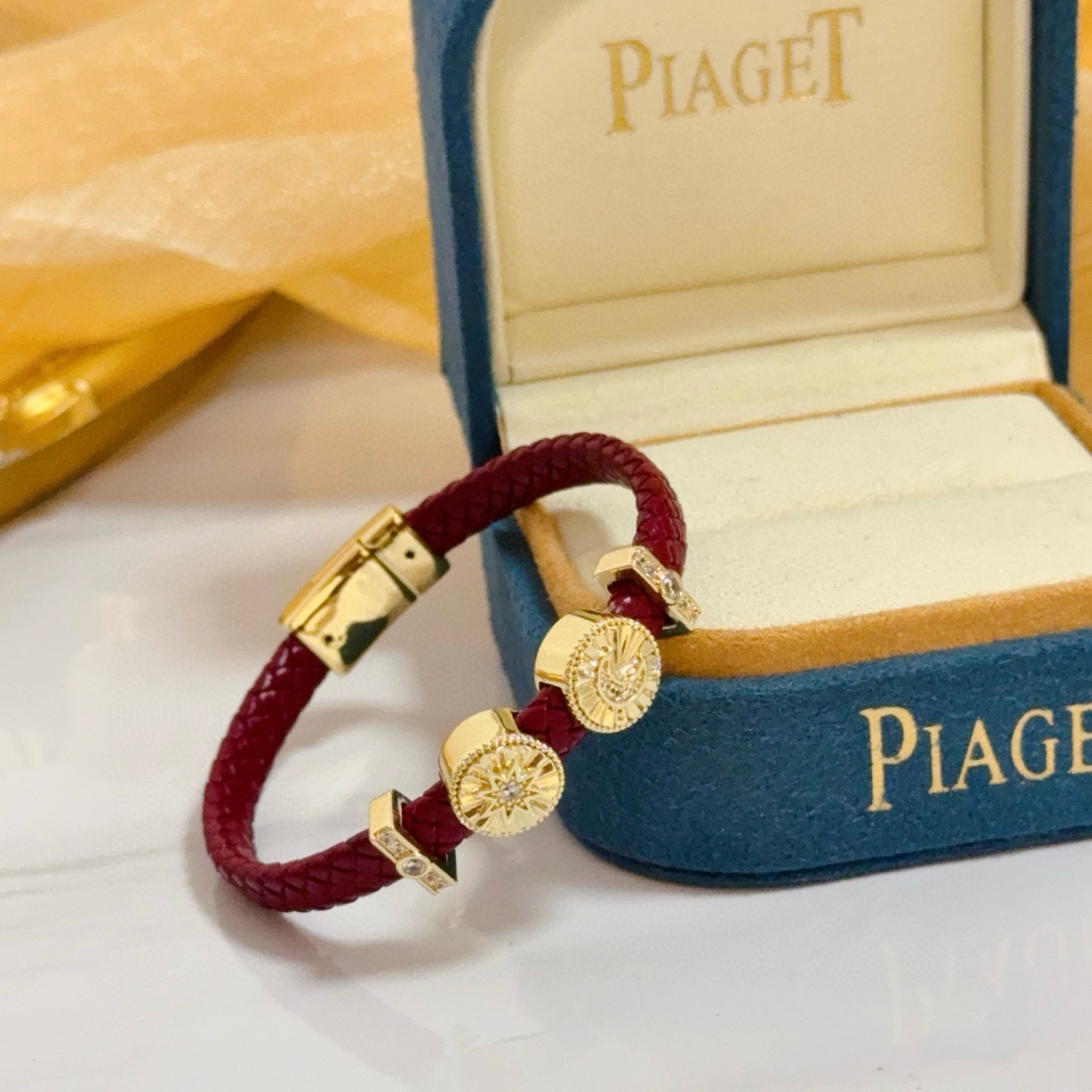 Piaget Possession bracelet Yellow gold burgundy braided leather clear diamond accents 17cm