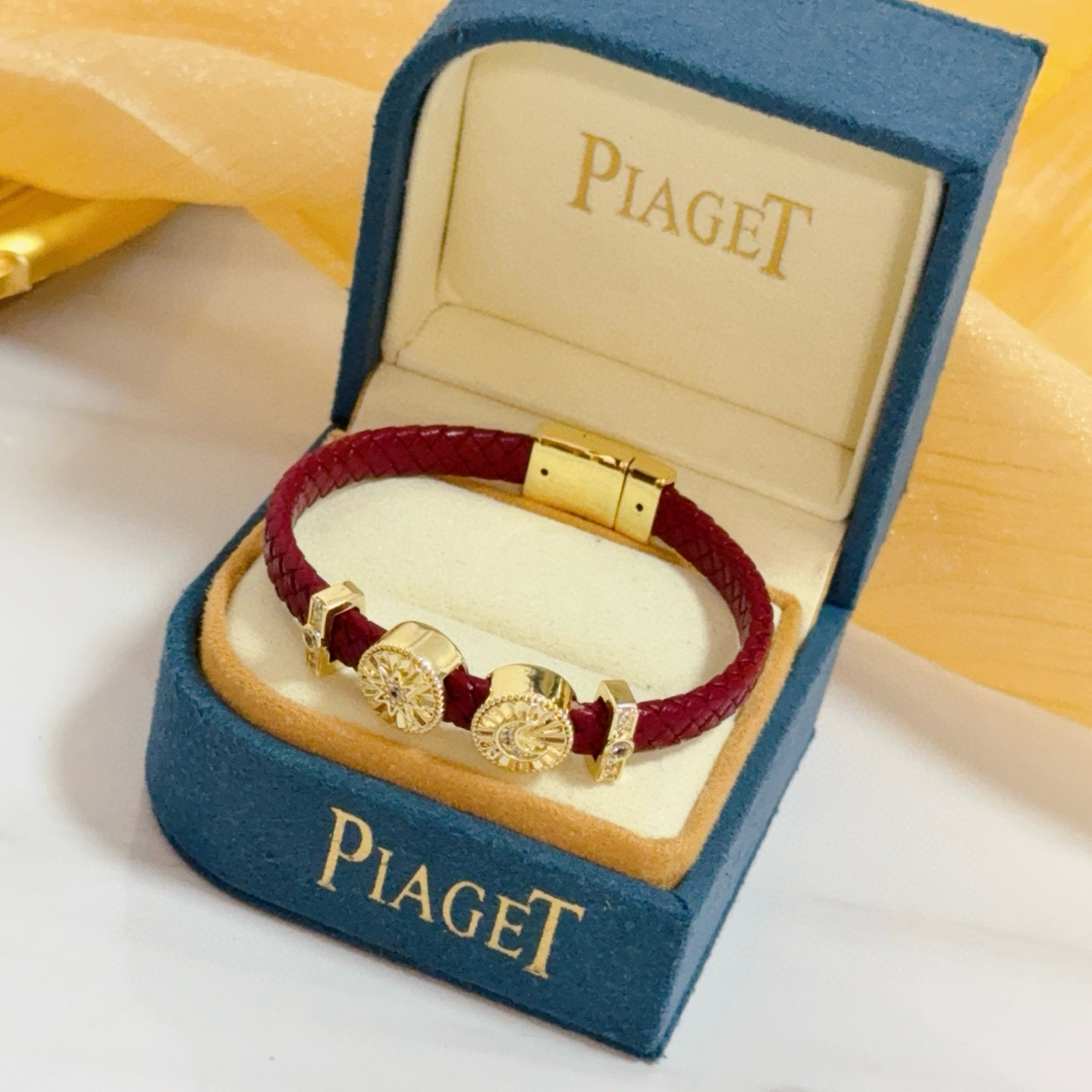 Piaget Possession bracelet Yellow gold burgundy braided leather clear diamond accents 17cm