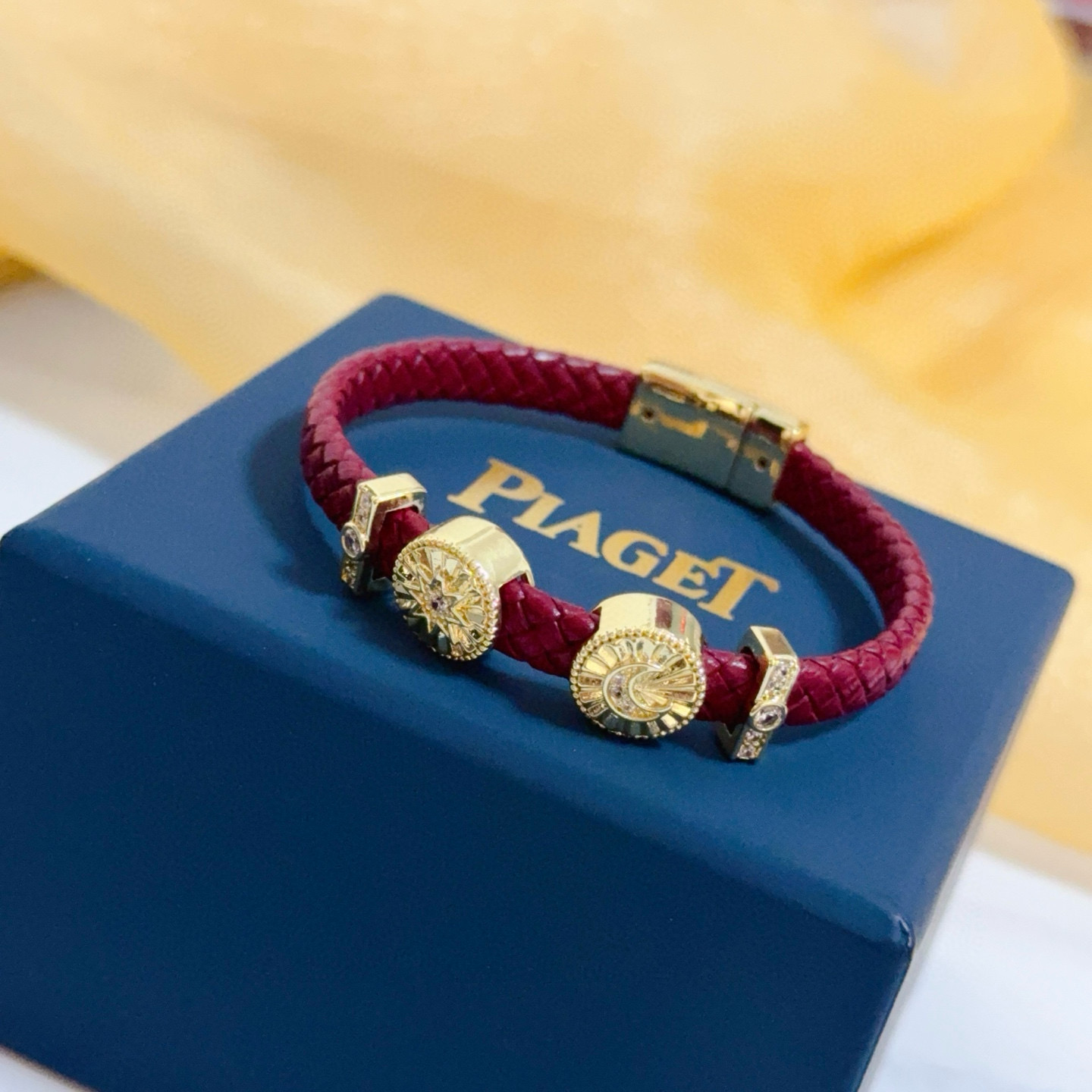 Piaget Possession bracelet Yellow gold burgundy braided leather clear diamond accents 17cm