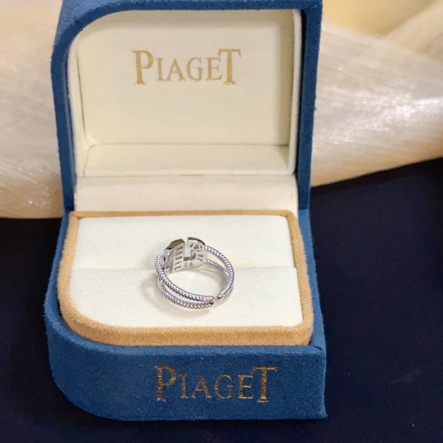 Piaget Possession ring silver-toned white gold with clear diamond accents adjustable open size