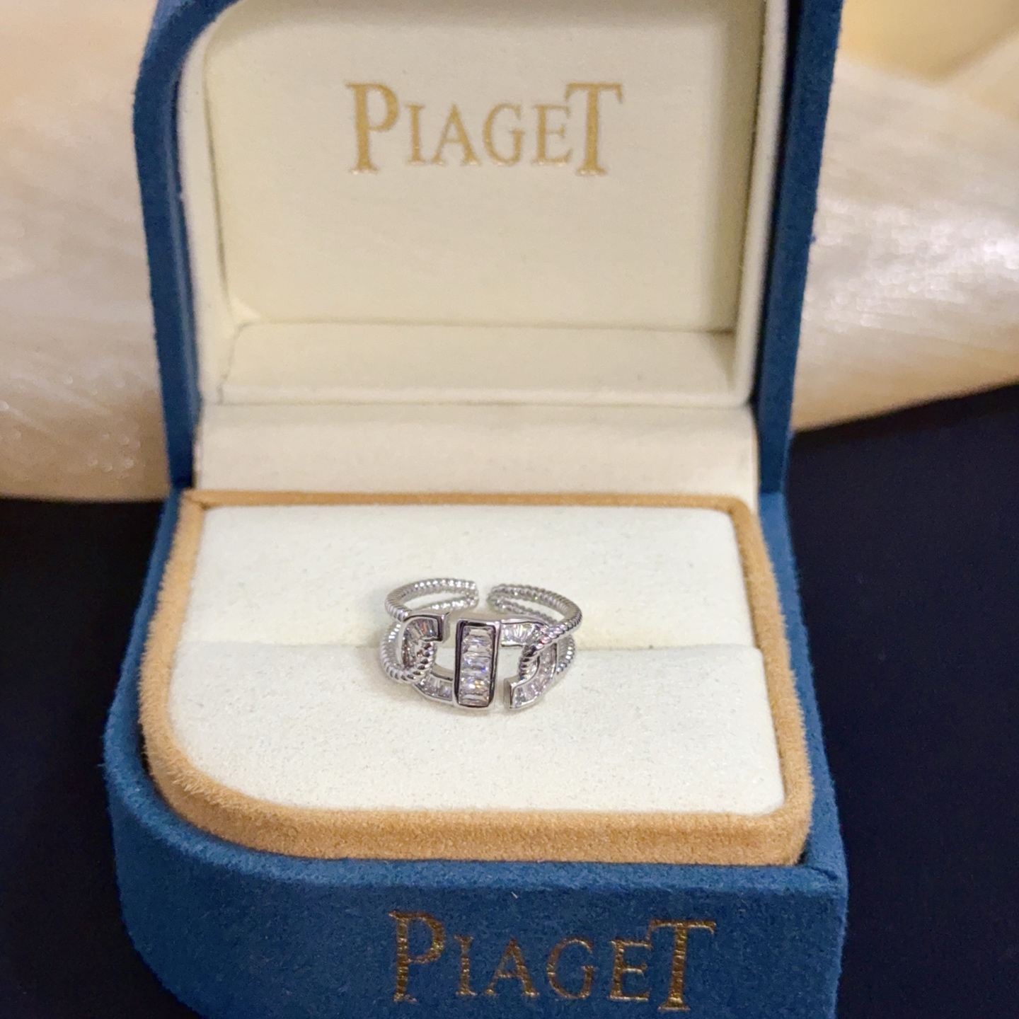 Piaget Possession ring silver-toned white gold with clear diamond accents adjustable open size