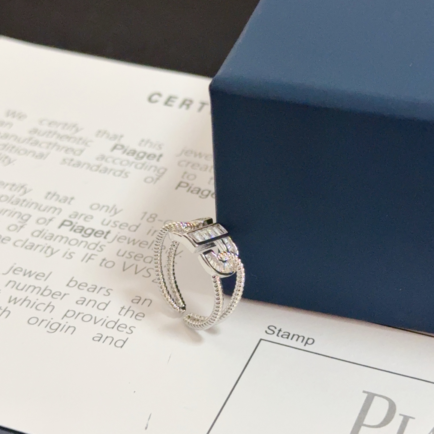 Piaget Possession ring silver-toned white gold with clear diamond accents adjustable open size
