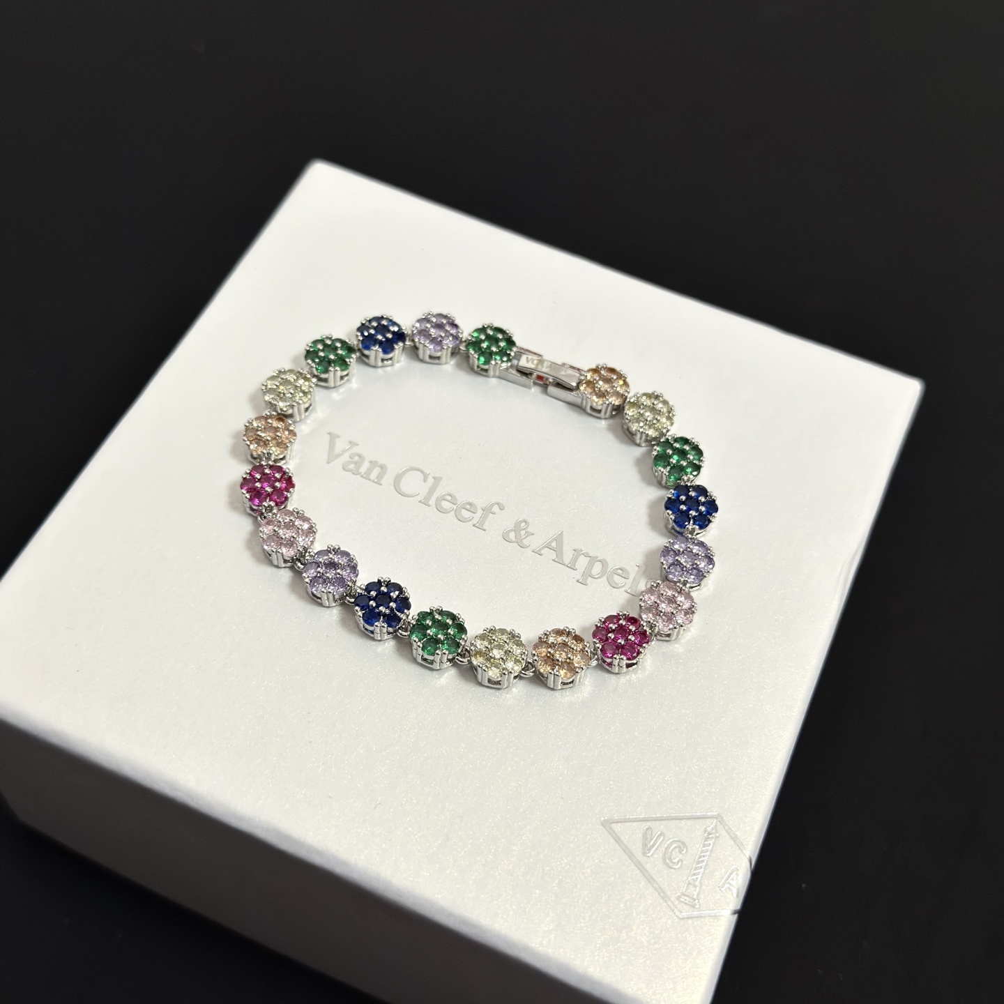 Van Cleef Arpels Fleurette bracelet silver-toned metal with multicolor gemstones green blue purple pink red champagne clear 17cm