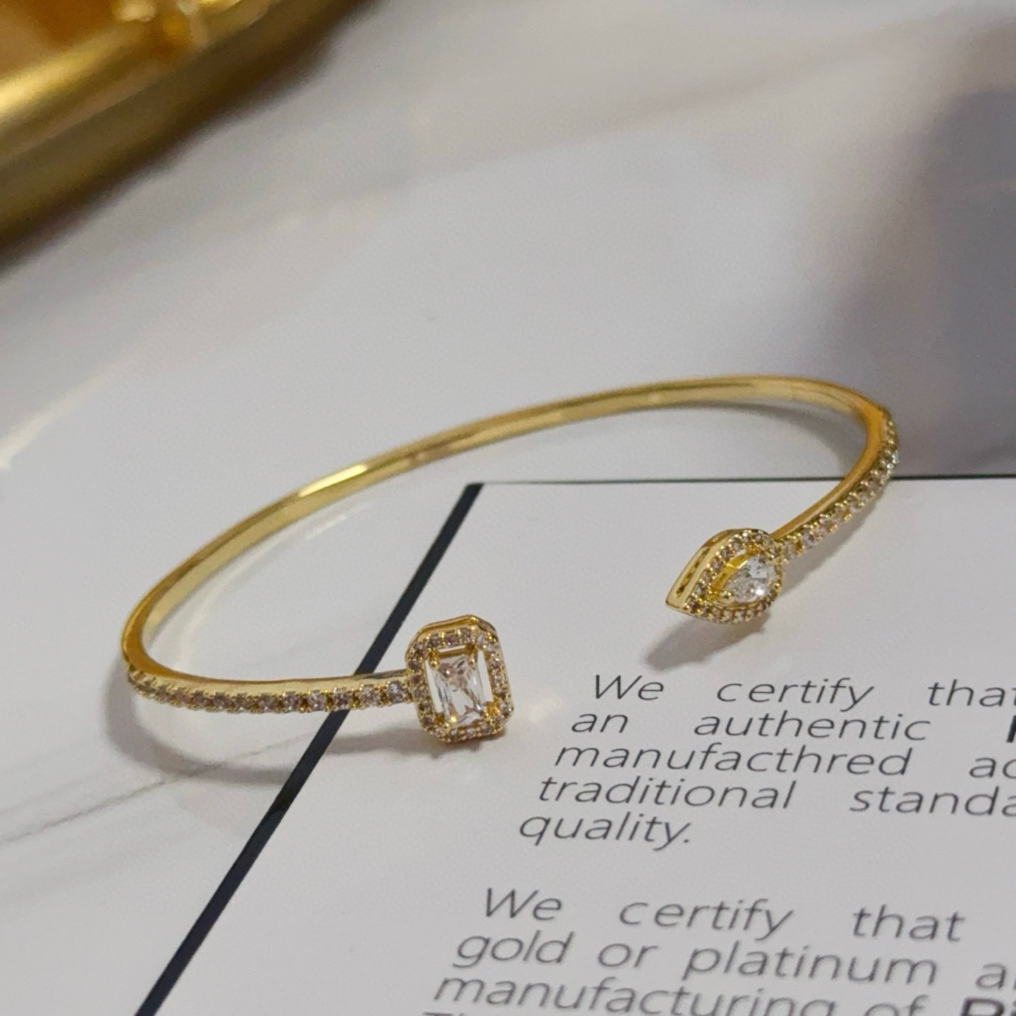 Piaget Treasures Open Cuff Bangle bracelet 18k yellow gold with clear diamond accent stones 17cm inner circumference