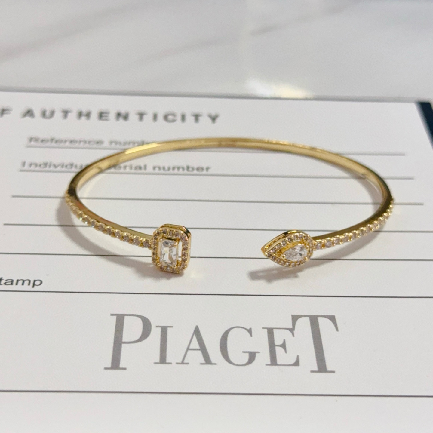 Piaget Treasures Open Cuff Bangle bracelet 18k yellow gold with clear diamond accent stones 17cm inner circumference