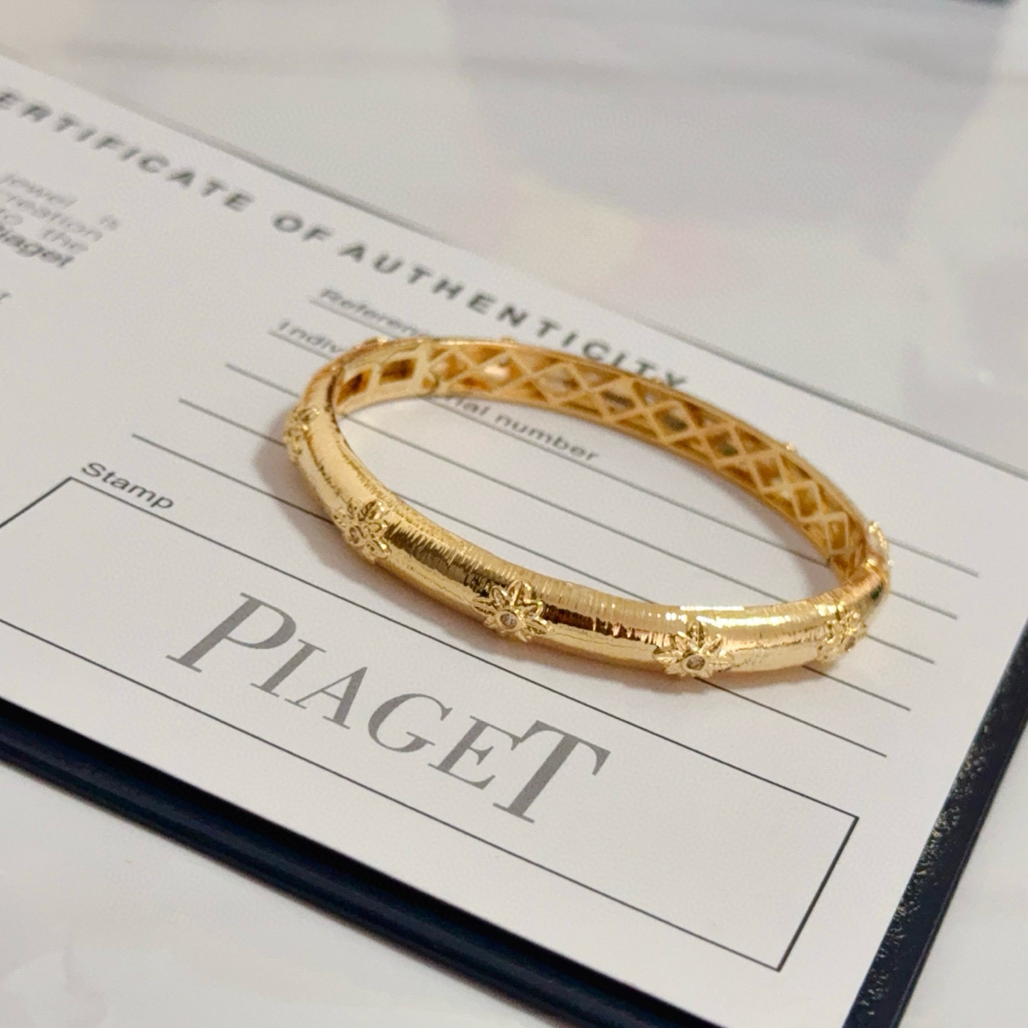 Piaget Rose Bangle bracelet 18k yellow gold with clear diamond accents 17cm inner circumference