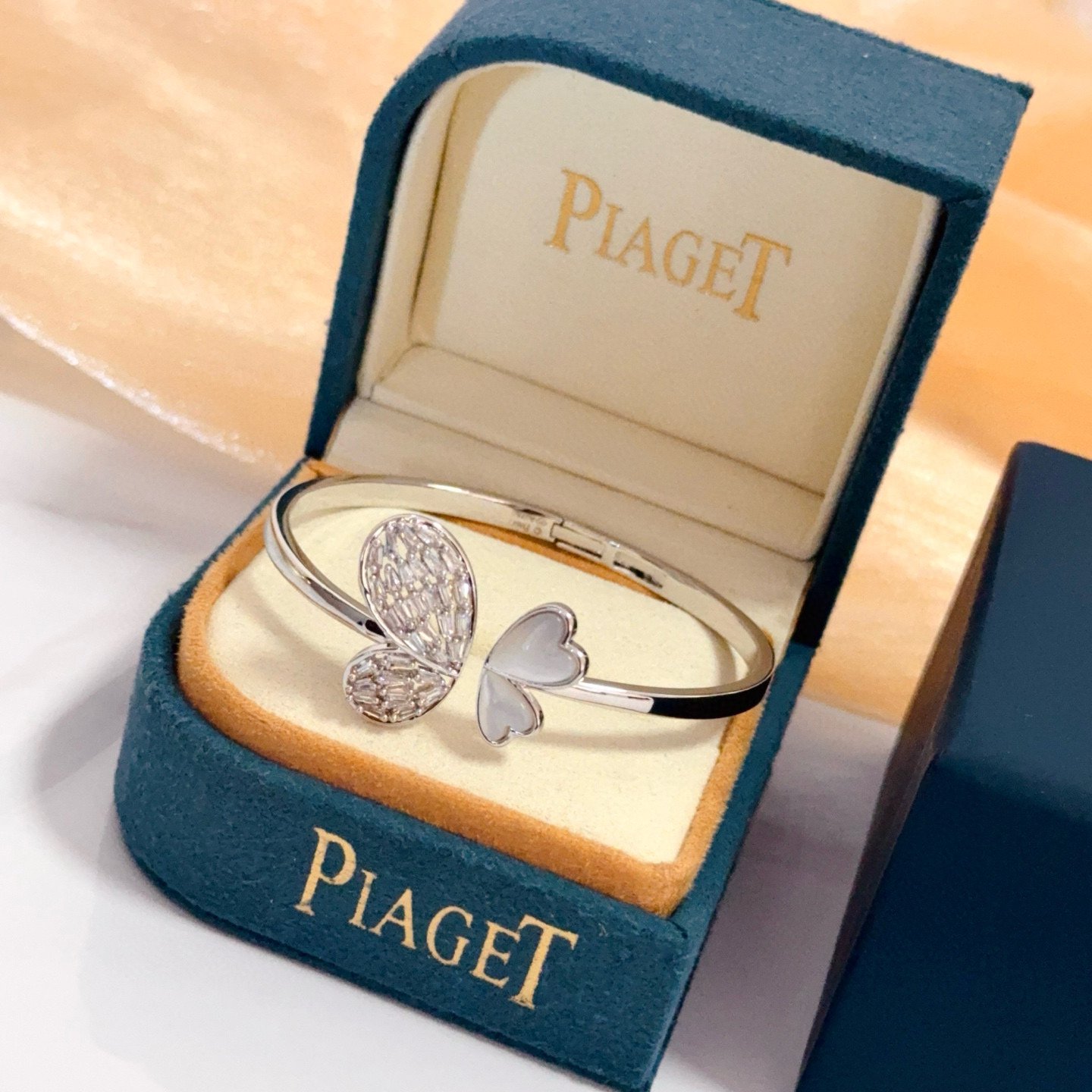 Piaget Butterfly Heart Open Bangle bracelet Silver-toned white gold metal clear baguette-cut diamonds white mother-of-pearl 16cm inner circumference