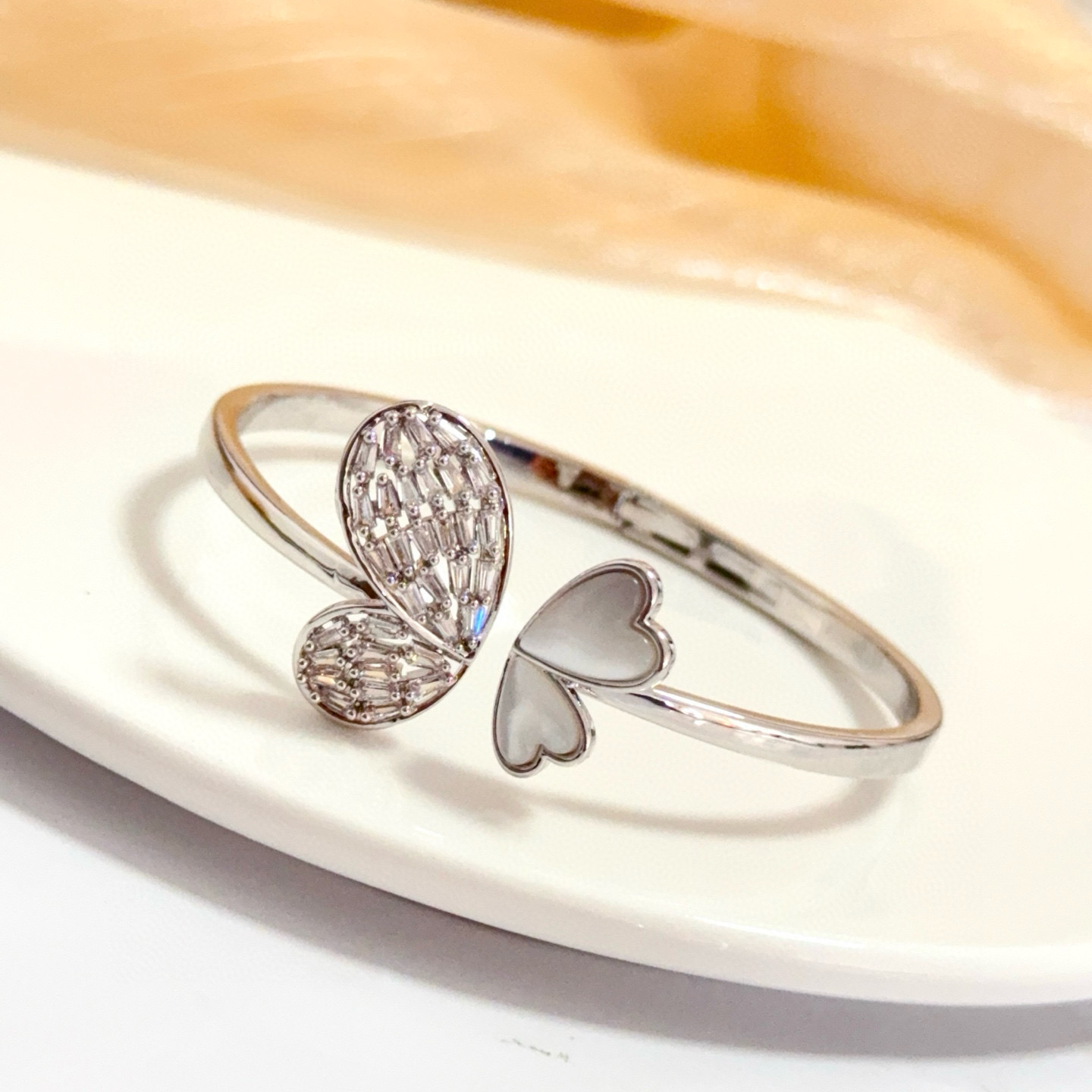 Piaget Butterfly Heart Open Bangle bracelet Silver-toned white gold metal clear baguette-cut diamonds white mother-of-pearl 16cm inner circumference