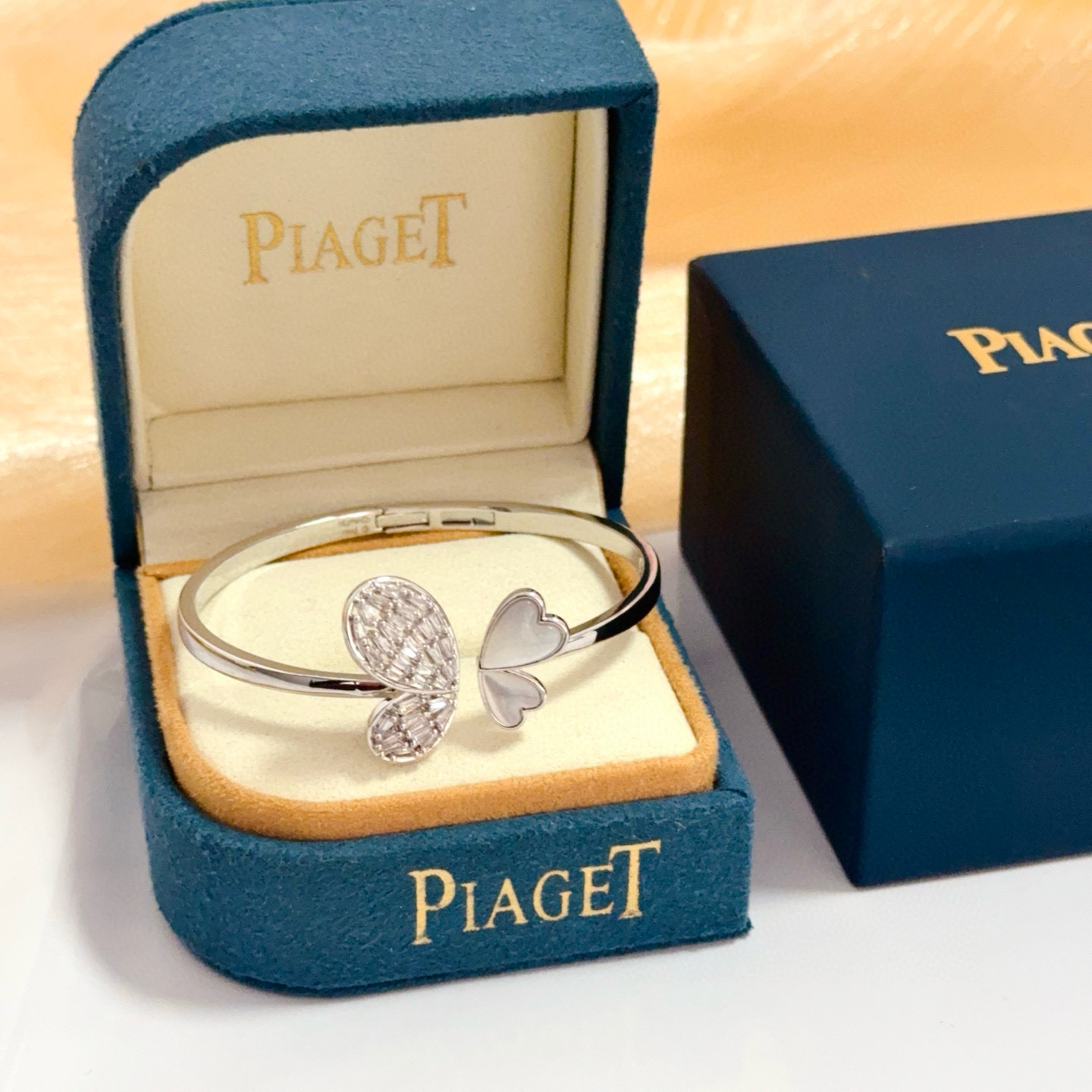 Piaget Butterfly Heart Open Bangle bracelet Silver-toned white gold metal clear baguette-cut diamonds white mother-of-pearl 16cm inner circumference