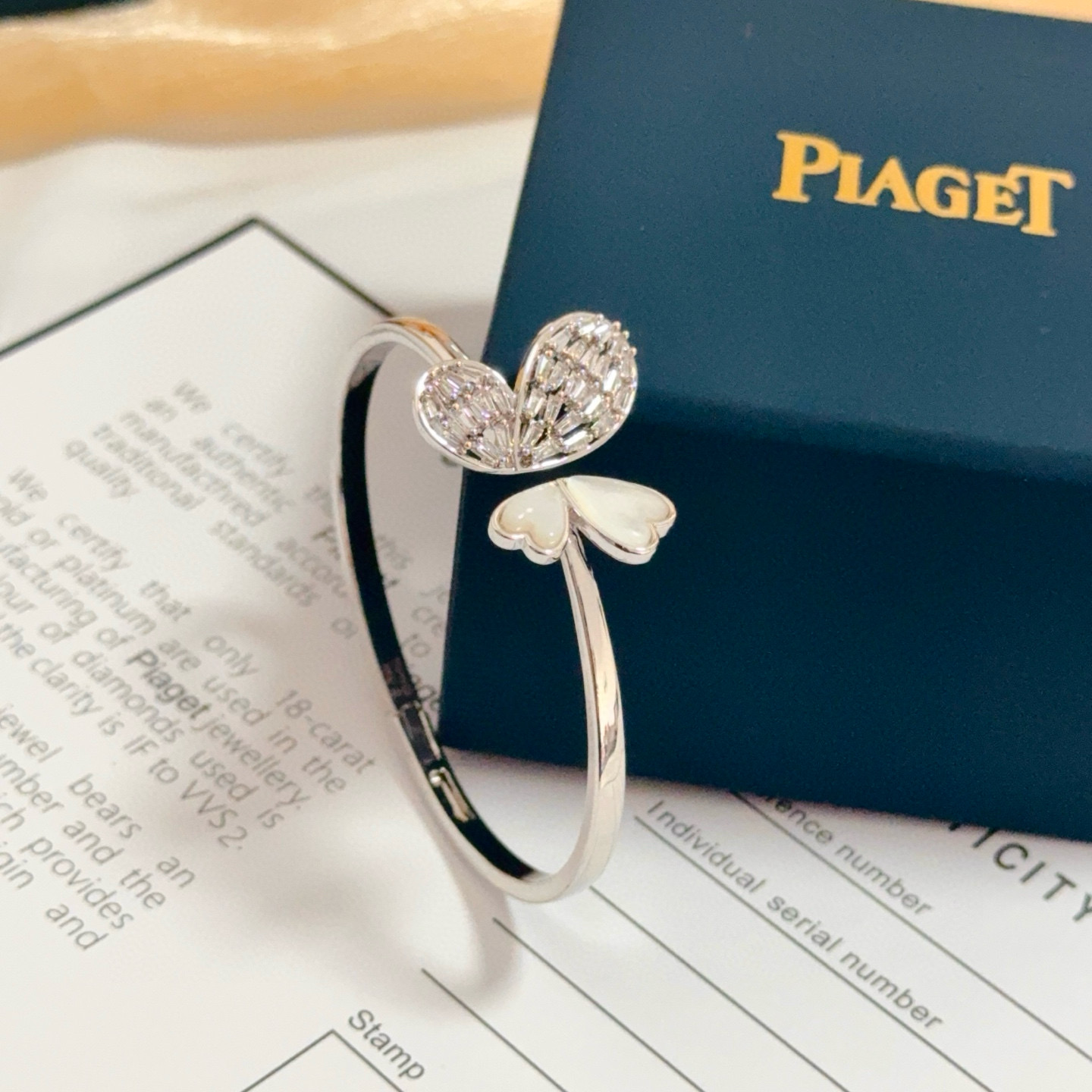 Piaget Butterfly Heart Open Bangle bracelet Silver-toned white gold metal clear baguette-cut diamonds white mother-of-pearl 16cm inner circumference