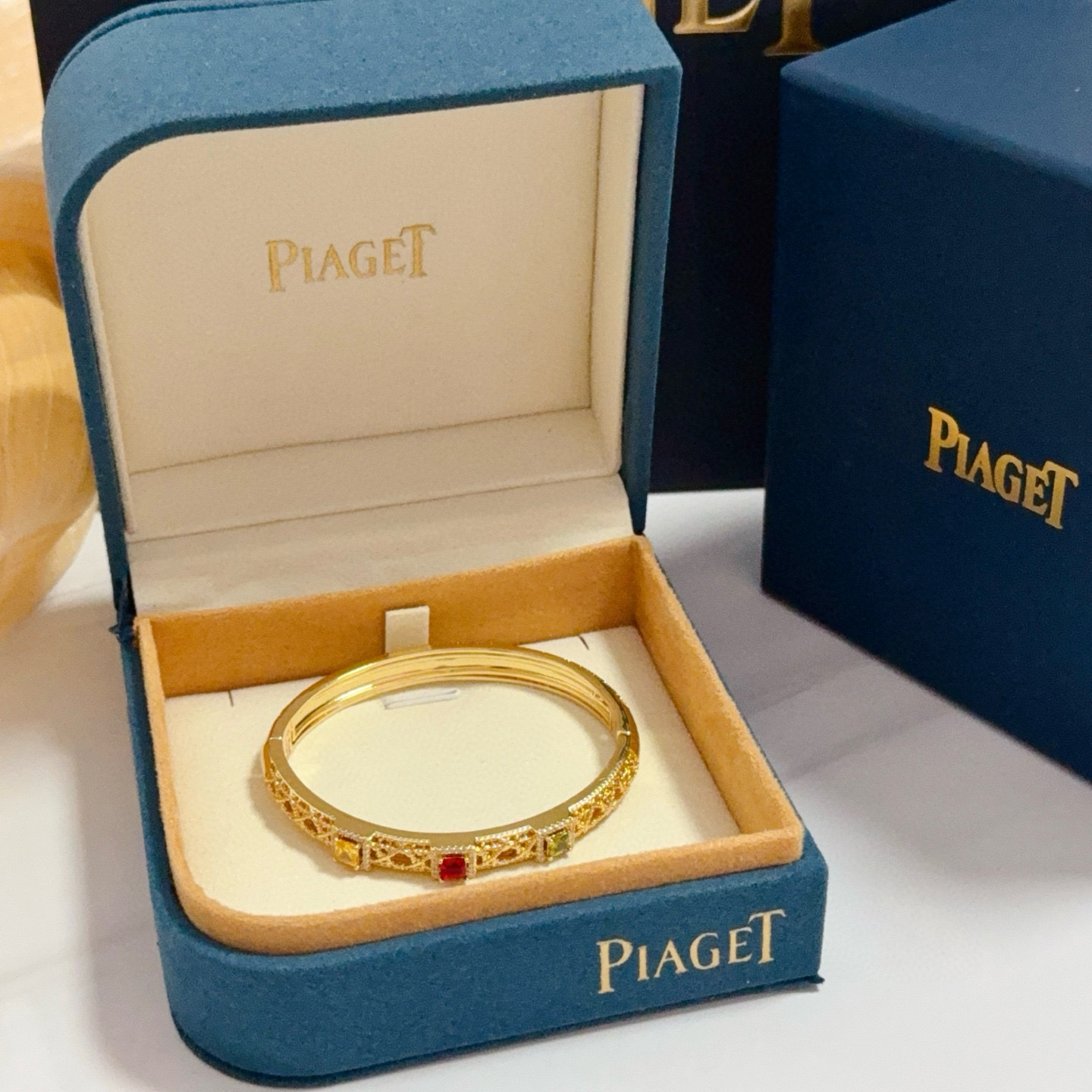 Piaget Sunlight Journey bracelet 18k yellow gold with red yellow green gemstones and diamond accents 17cm inner circumference