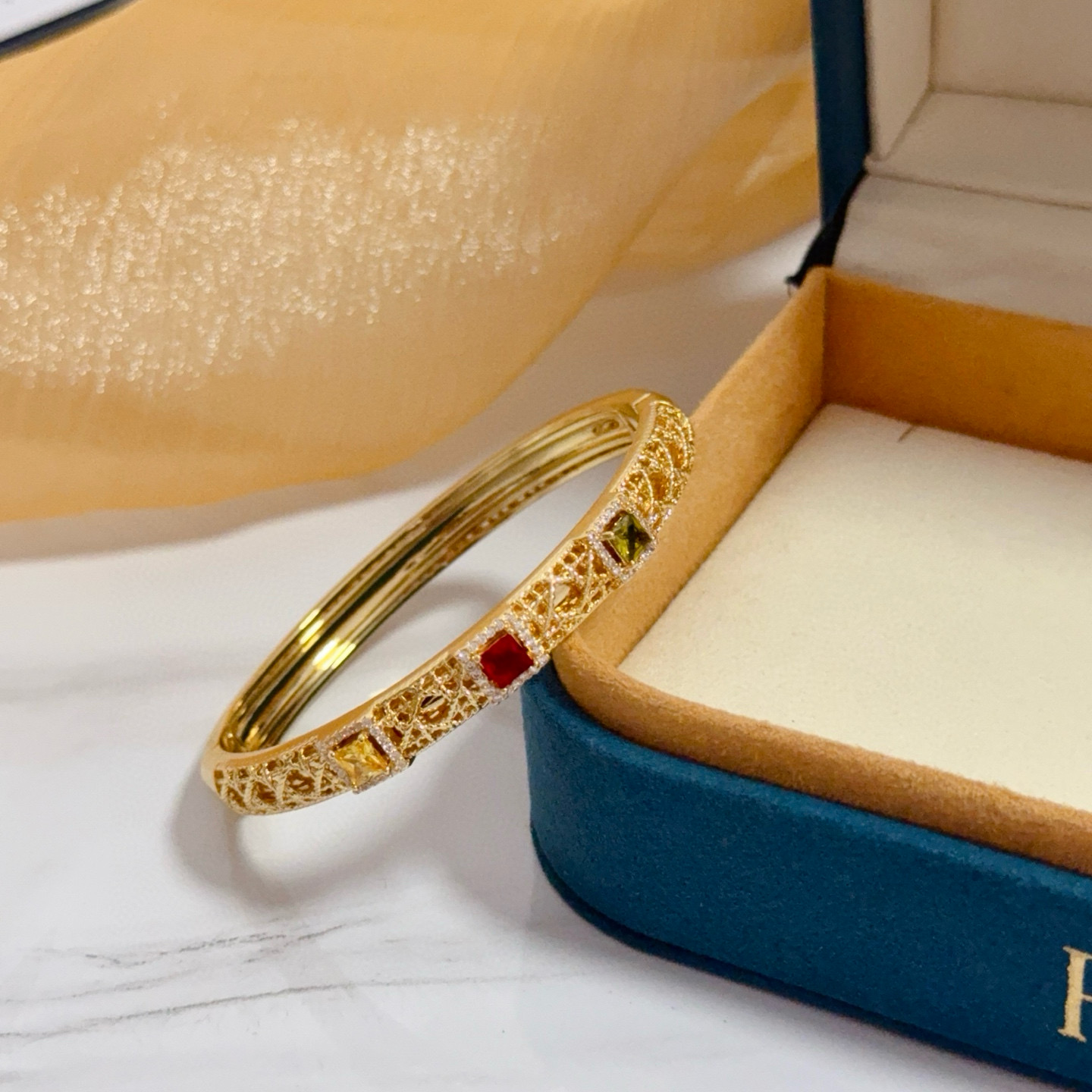 Piaget Sunlight Journey bracelet 18k yellow gold with red yellow green gemstones and diamond accents 17cm inner circumference