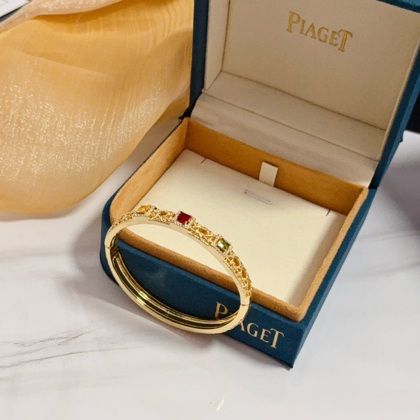 Piaget Sunlight Journey bracelet 18k yellow gold with red yellow green gemstones and diamond accents 17cm inner circumference