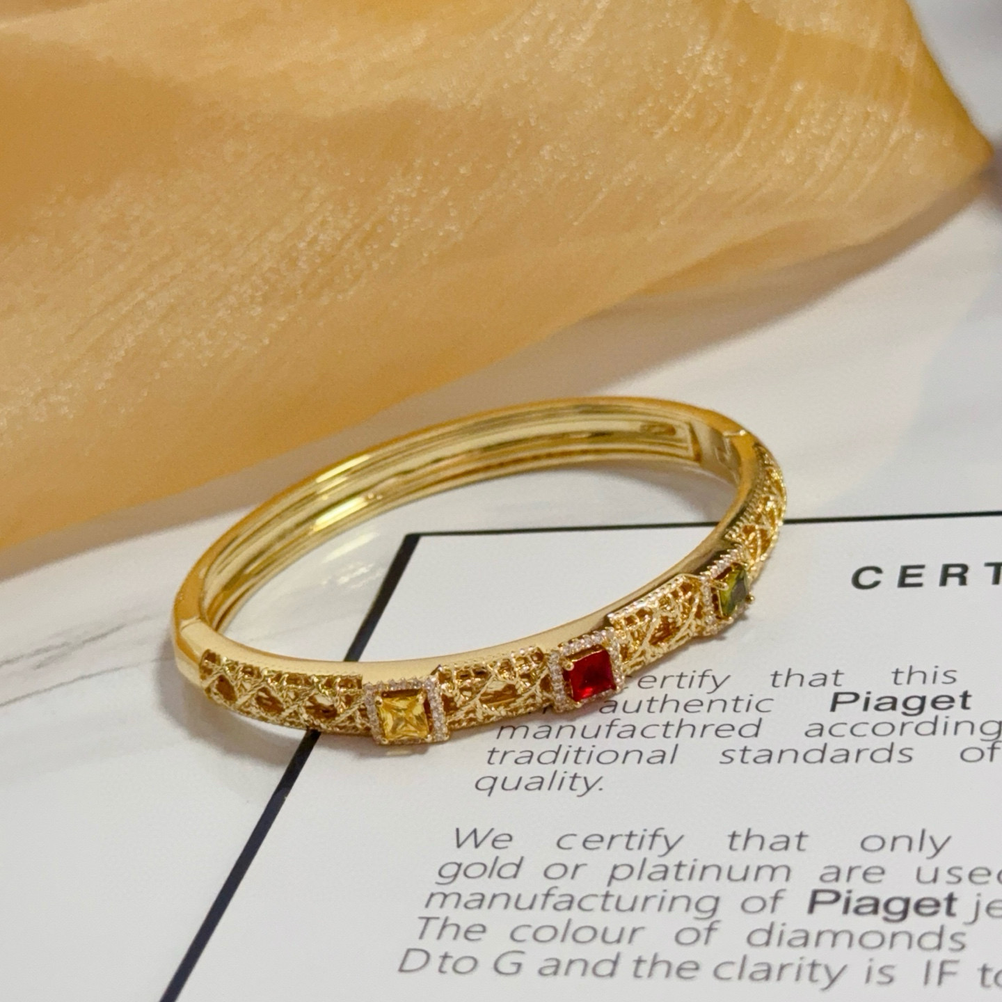 Piaget Sunlight Journey bracelet 18k yellow gold with red yellow green gemstones and diamond accents 17cm inner circumference